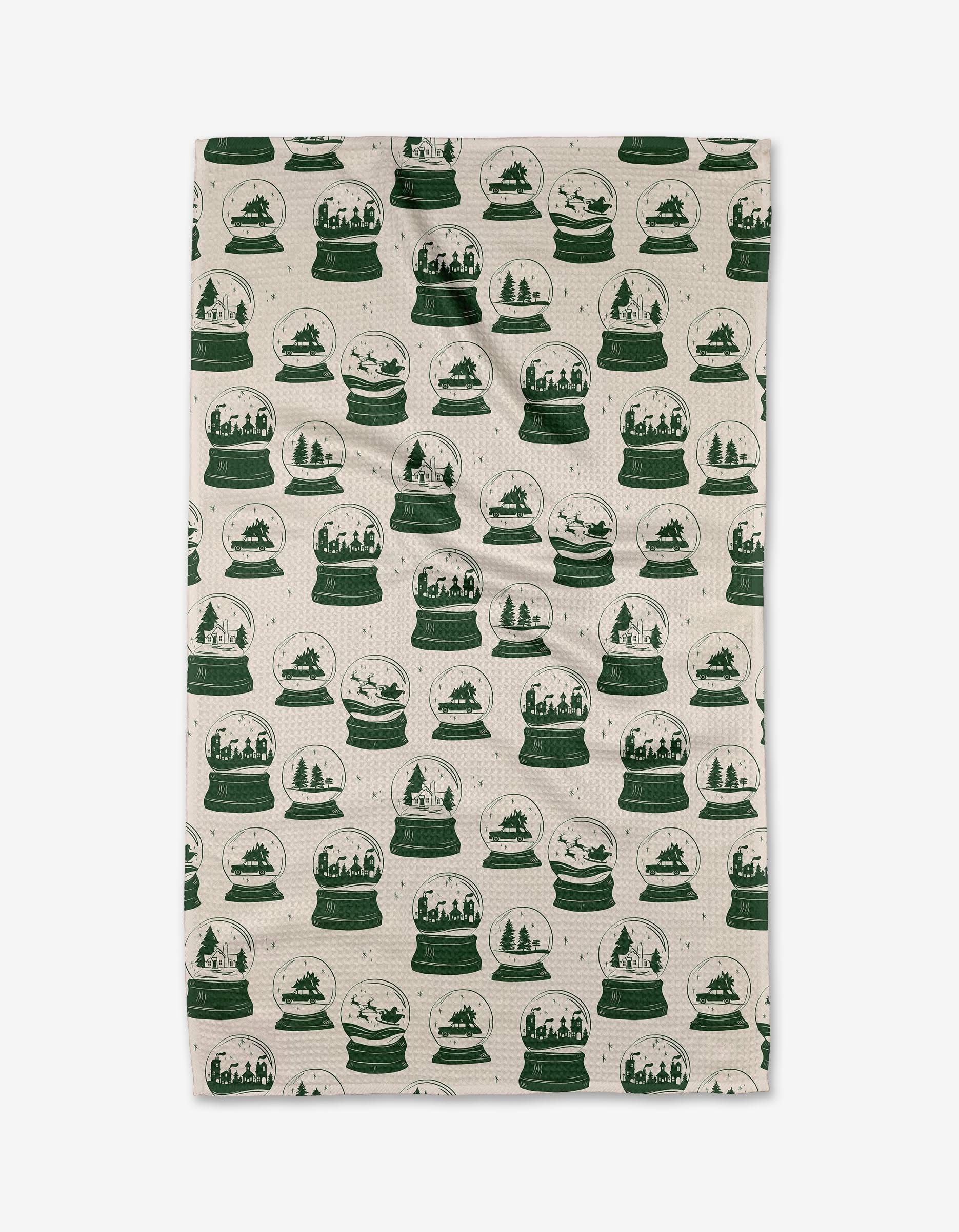 The Aubrey Fairchild Vintage Snow Globes Green tea towel features a beige base with green snow globes displaying wintry scenes. Made from quick-drying recycled materials, the design covers the entire towel.