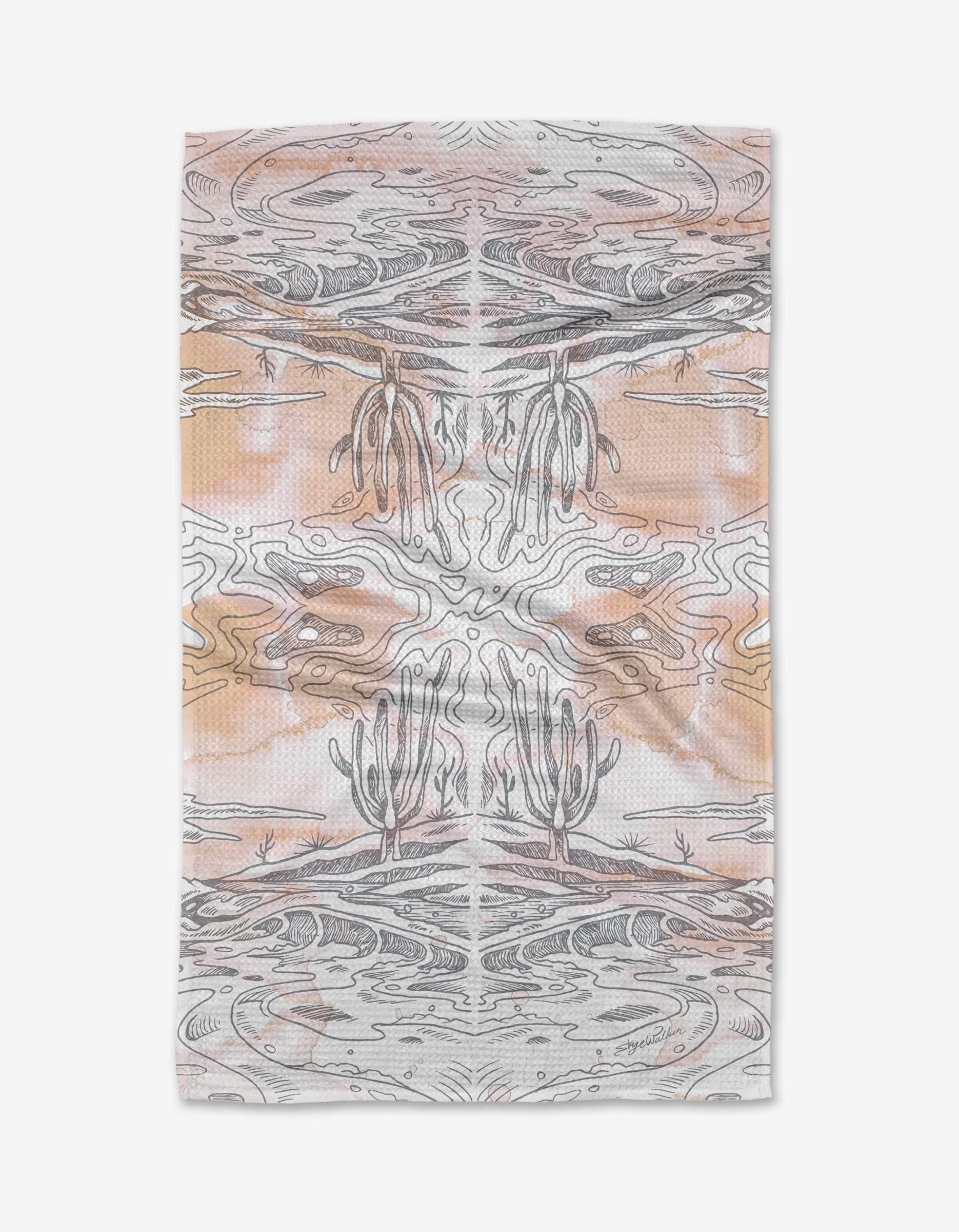 The Waves tea towel by Skye Walker is crafted from recycled materials and features a mirrored desert scene with cacti, rocks, and swirling lines in beige, brown, and orange for an abstract, symmetrical look.