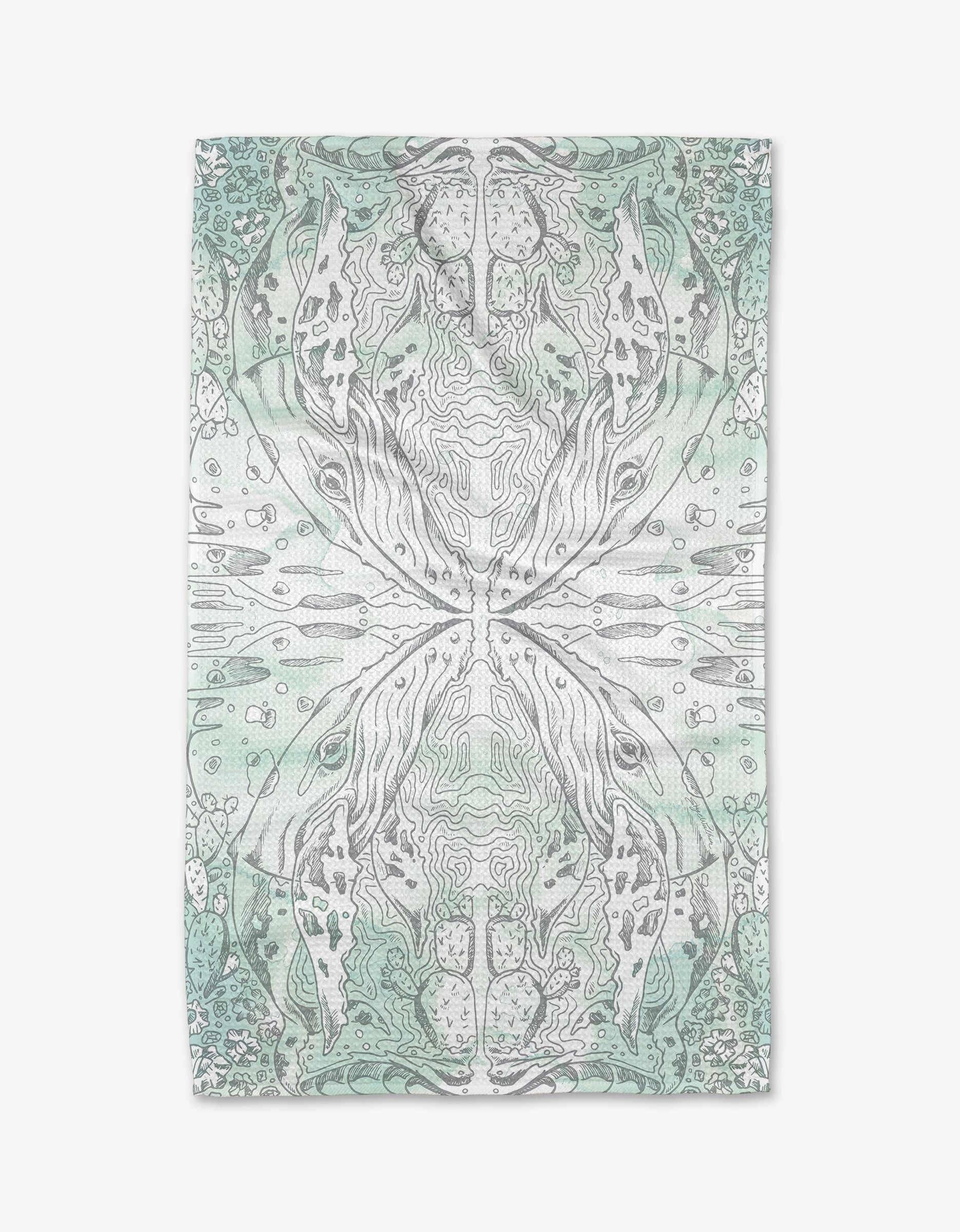 The Whale kitchen tea towel by Skye Walker showcases an abstract design in soft green and gray, with symmetrical, organic patterns and topographic lines on a rectangular towel crafted from recycled materials.