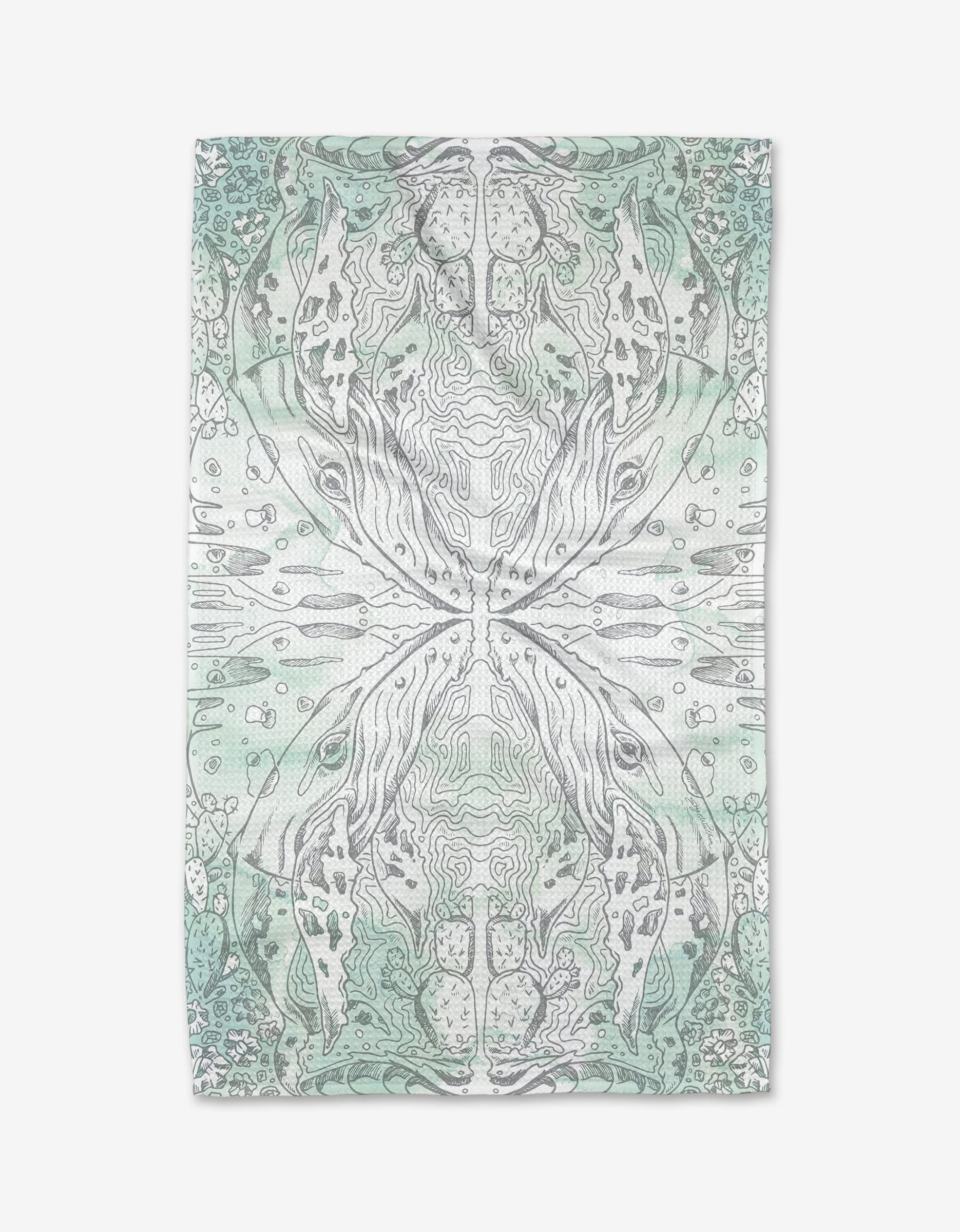 The Whale kitchen tea towel by Skye Walker showcases an abstract design in soft green and gray, with symmetrical, organic patterns and topographic lines on a rectangular towel crafted from recycled materials.