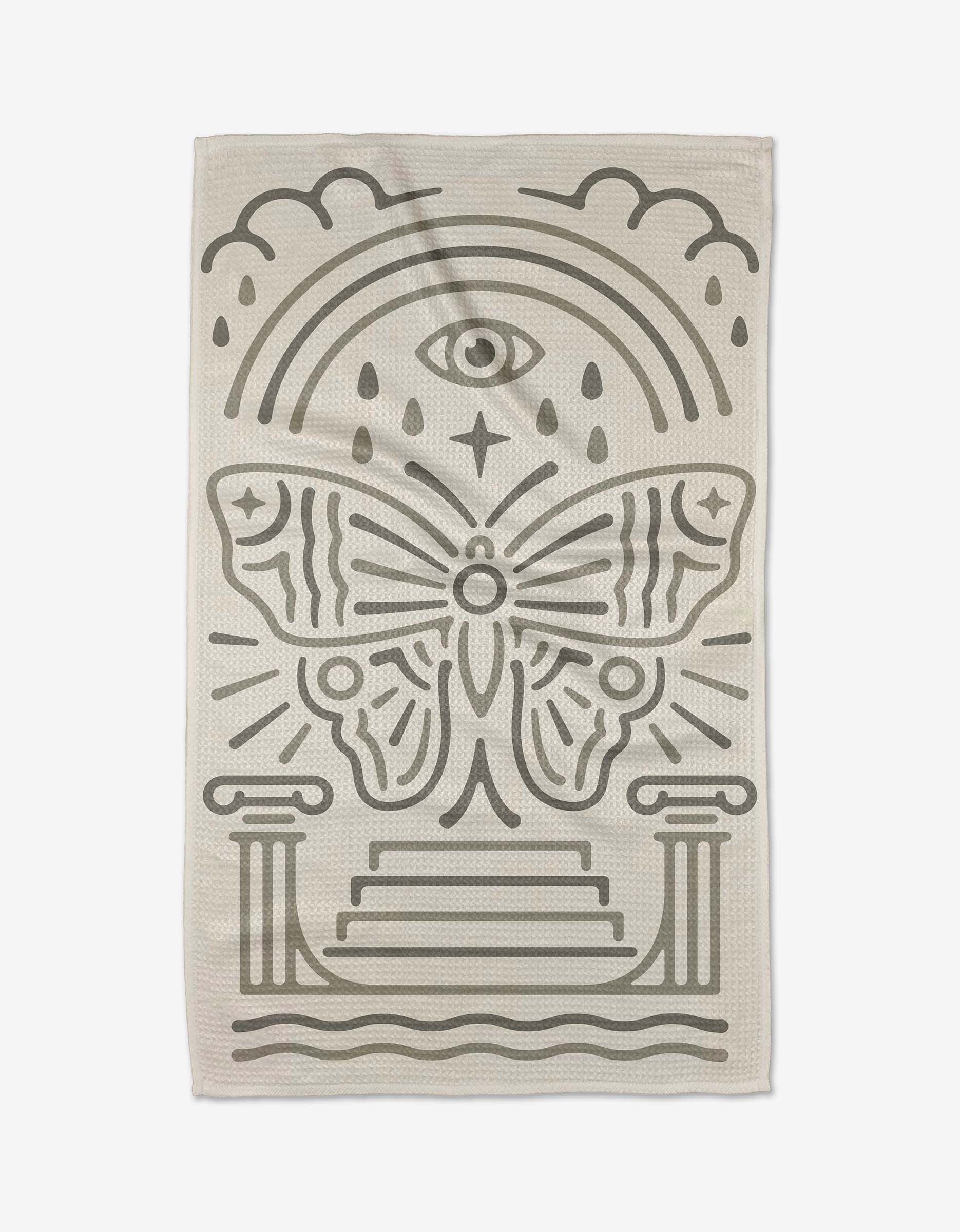 The Alter Tea Towel by Adam Nienow features bold, geometric motifs—an eye, teardrops, clouds, and a butterfly above steps—printed in black on beige Geoweave™ fabric for distinctive style and symmetry.
