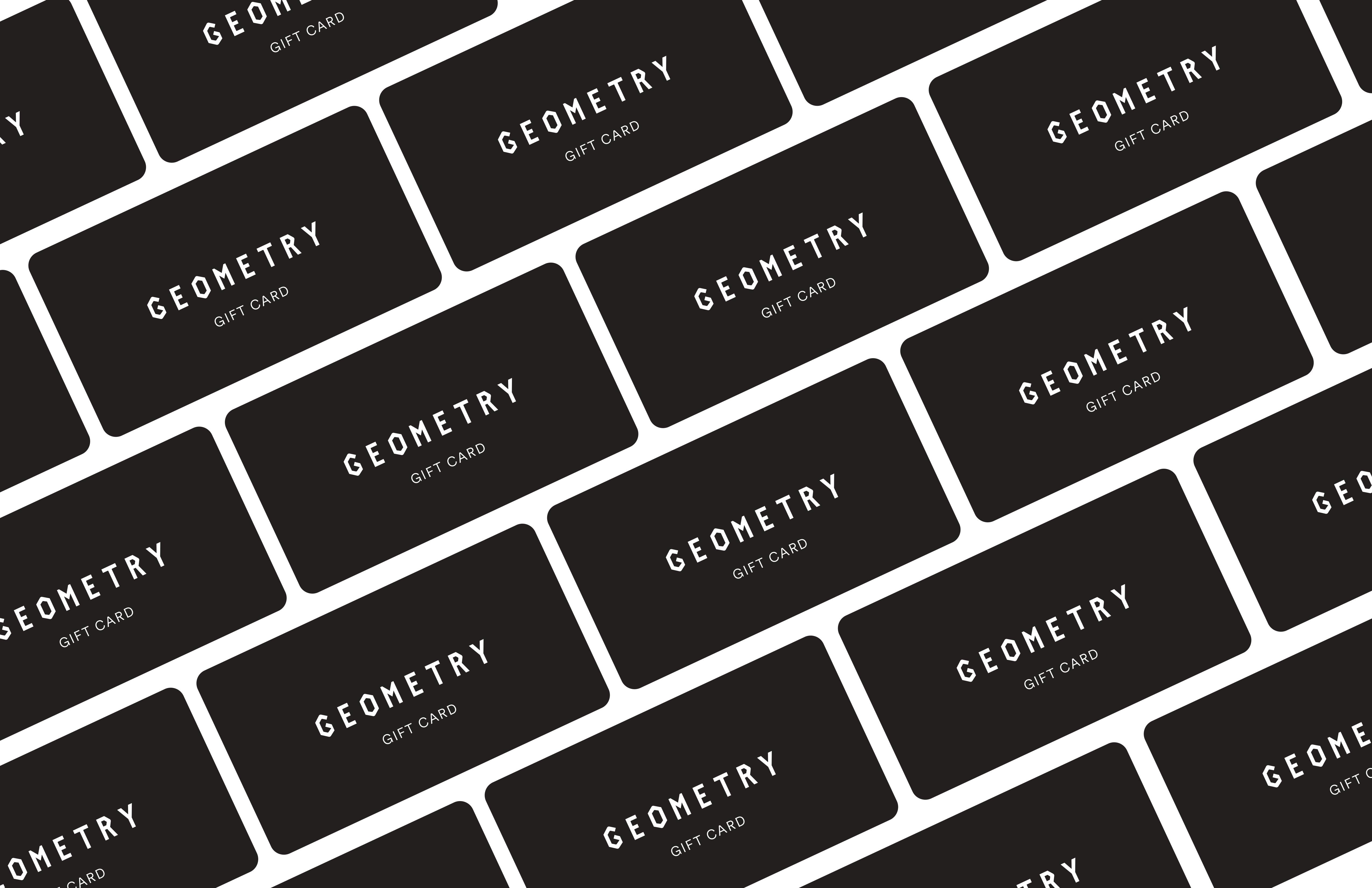 A pattern of black gift cards, each labeled GEOMETRY GIFT CARD in white, arranged diagonally in a repeating, overlapping layout on a white background.