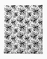 Botanical Silhouettes Charcoal by Danelys Sidron is a white fabric with repeating black floral clusters and leaves in a classic, elegant design, made from recycled materials for an eco-friendly touch.