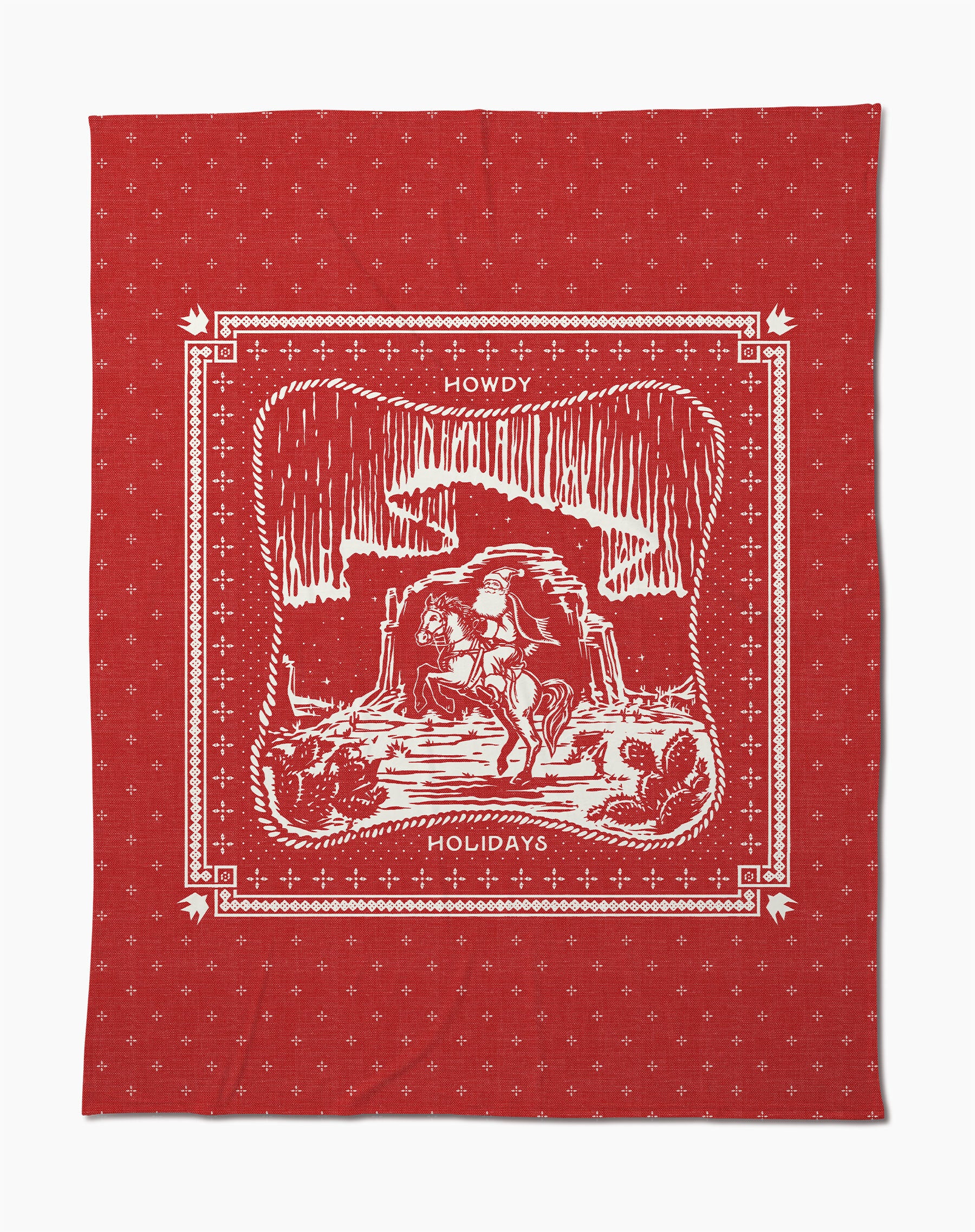 The Geometry Cowboy Christmas red butter blanket features a white cowboy-on-horse design with canyon, stars, cacti, and "Howdy Holidays" text—a festive and cozy soft throw for any space.