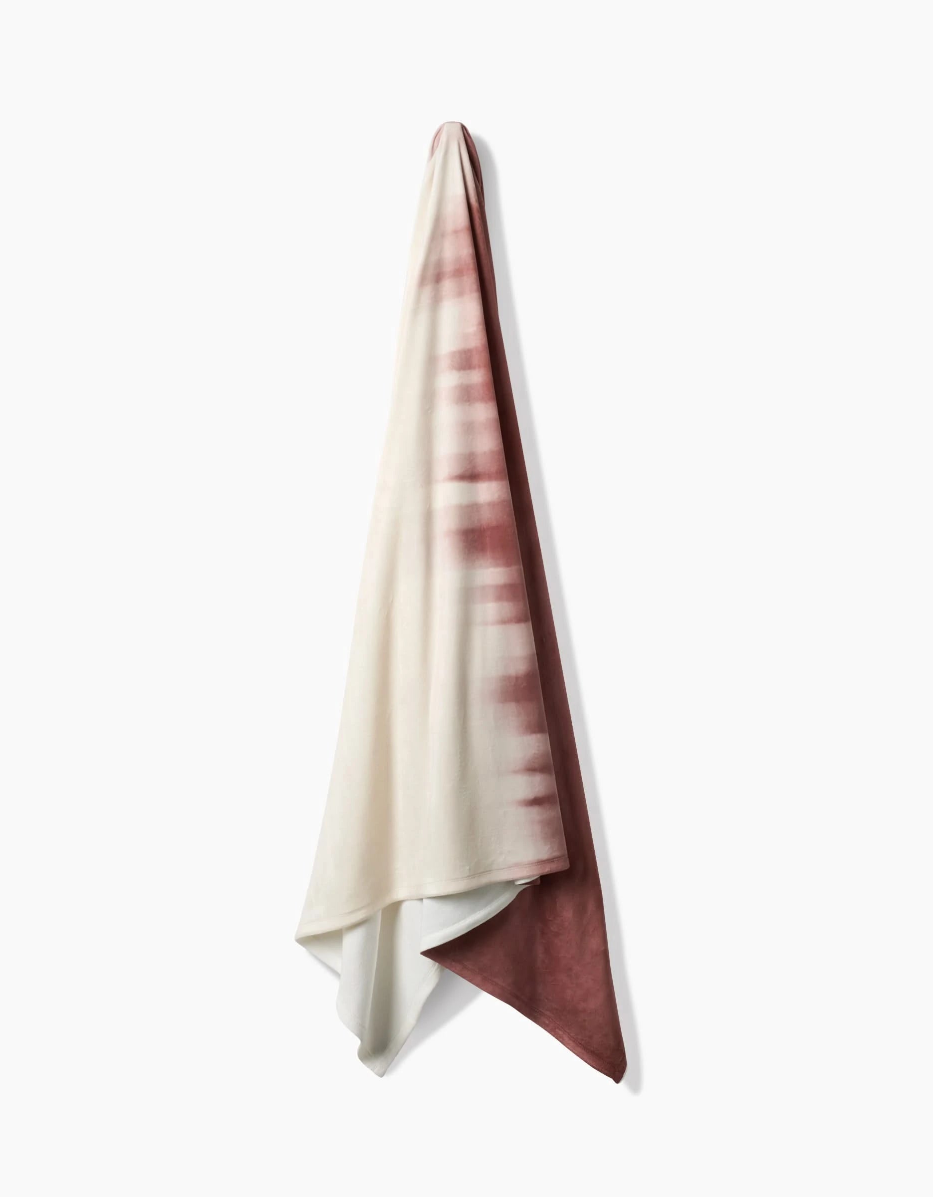 The Geometry Sundae is a soft, eco-friendly hanging blanket with a gradient tie-dye from white on the left to deep rose on the right, displayed against a plain white background.