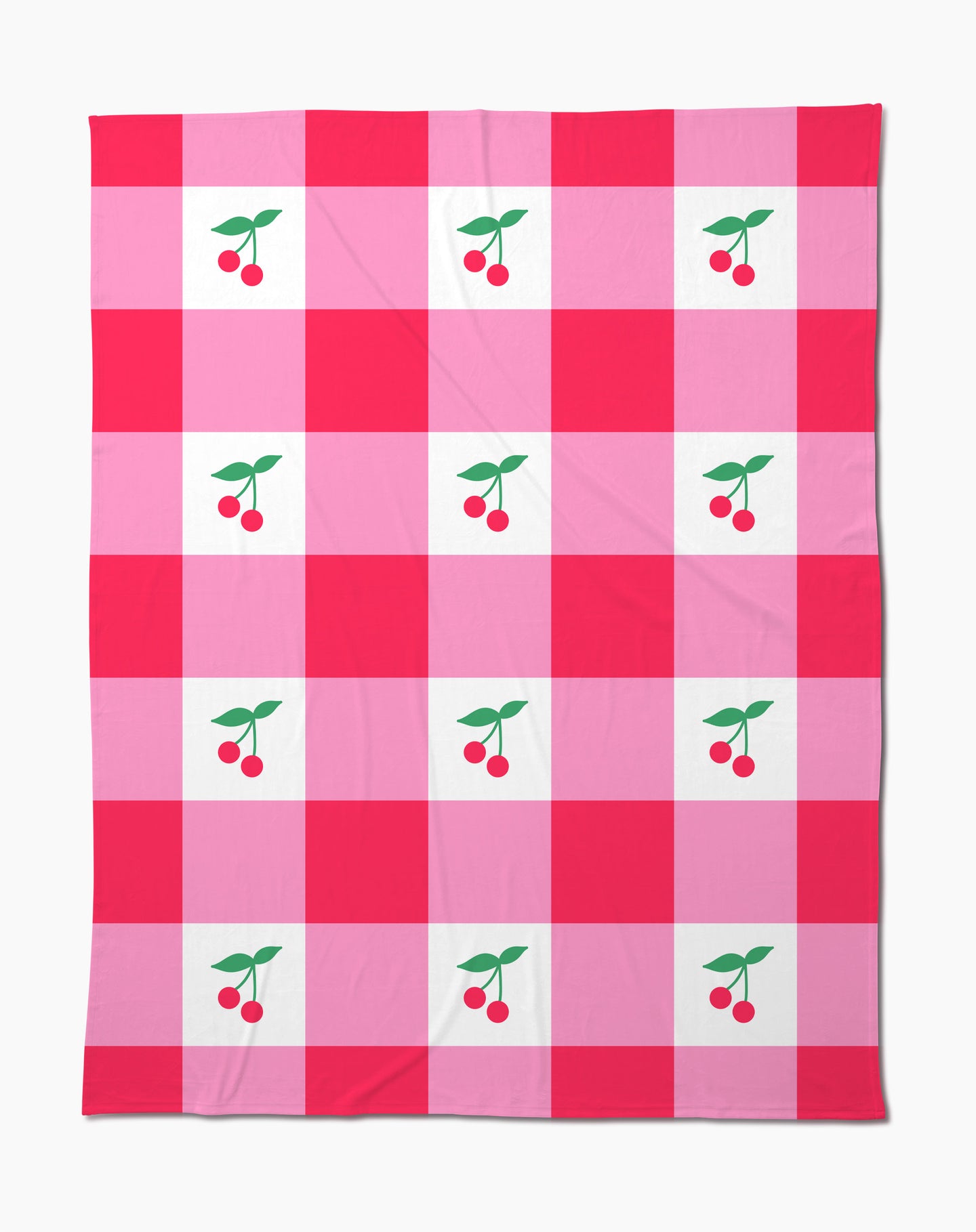 The Sweet Cherry Gingham throw blanket by Geometry features a soft fabric with a red and pink checkered pattern, accented by charming cherry illustrations with green leaves in the center of select squares.