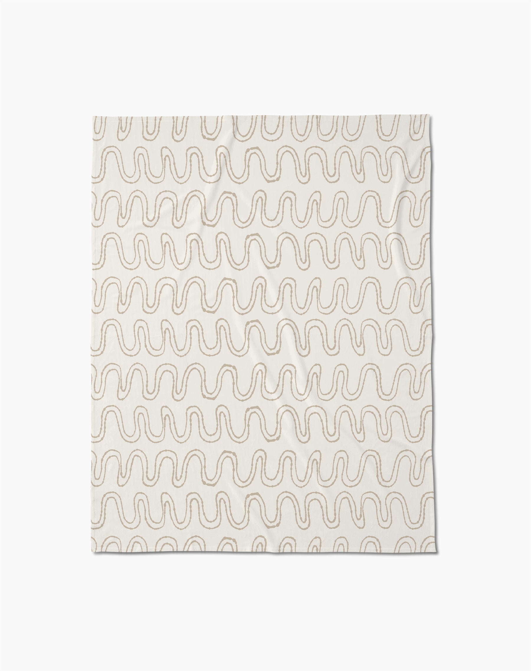 The Abstract Squiggles throw blanket by Geometry is crafted from recycled blankets for comfort and sustainability, featuring a soft cream color with evenly spaced wavy beige lines in a repeating pattern, displayed flat against a white background.