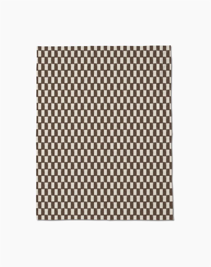 The Geometry Hot Coa Coa is a rectangular recycled throw blanket featuring a dense brown and white checkerboard pattern—perfect as a soft, eco-friendly accent for your space.