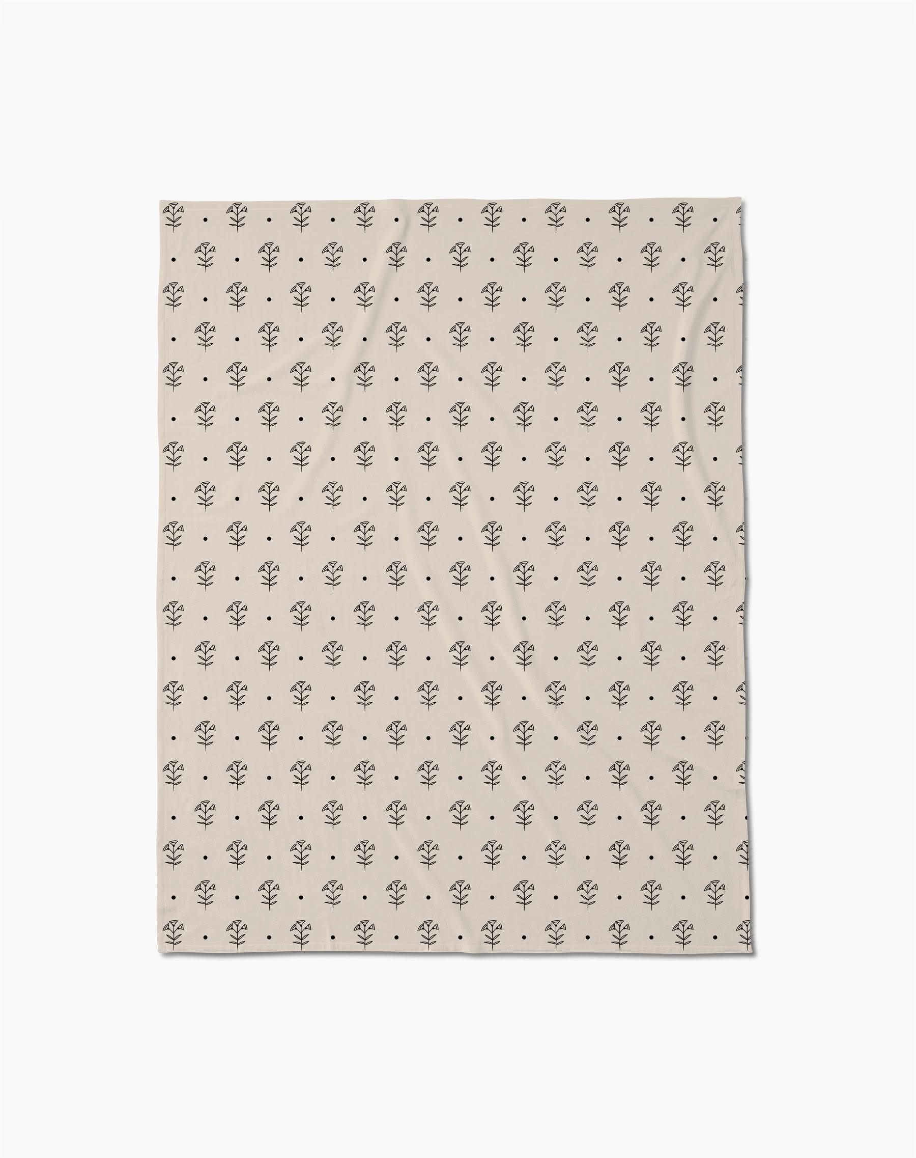 Inked Bloom by Cole Strem is a beige Butter Blanket with a repeating pattern of small, simple black tree illustrations, crafted from eco-friendly recycled materials.