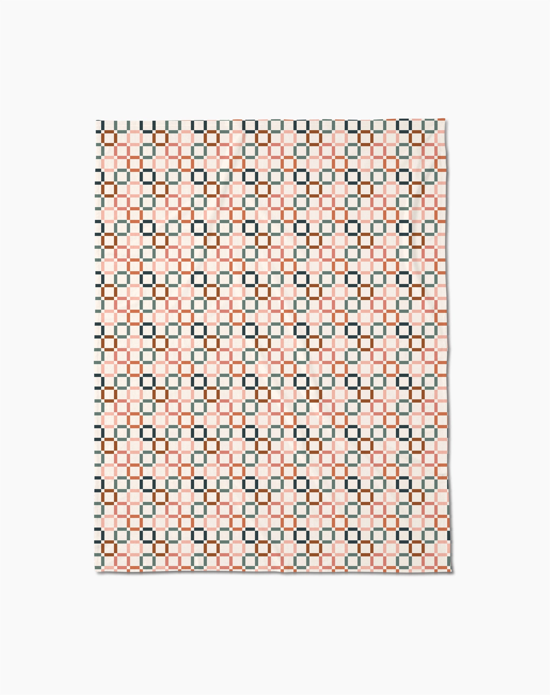 The Russet Crossroads Butter Blanket by Charlie Rowan Designs features a geometric grid of black, red, and cream squares on white, crafted from recycled materials for an eco-friendly touch.