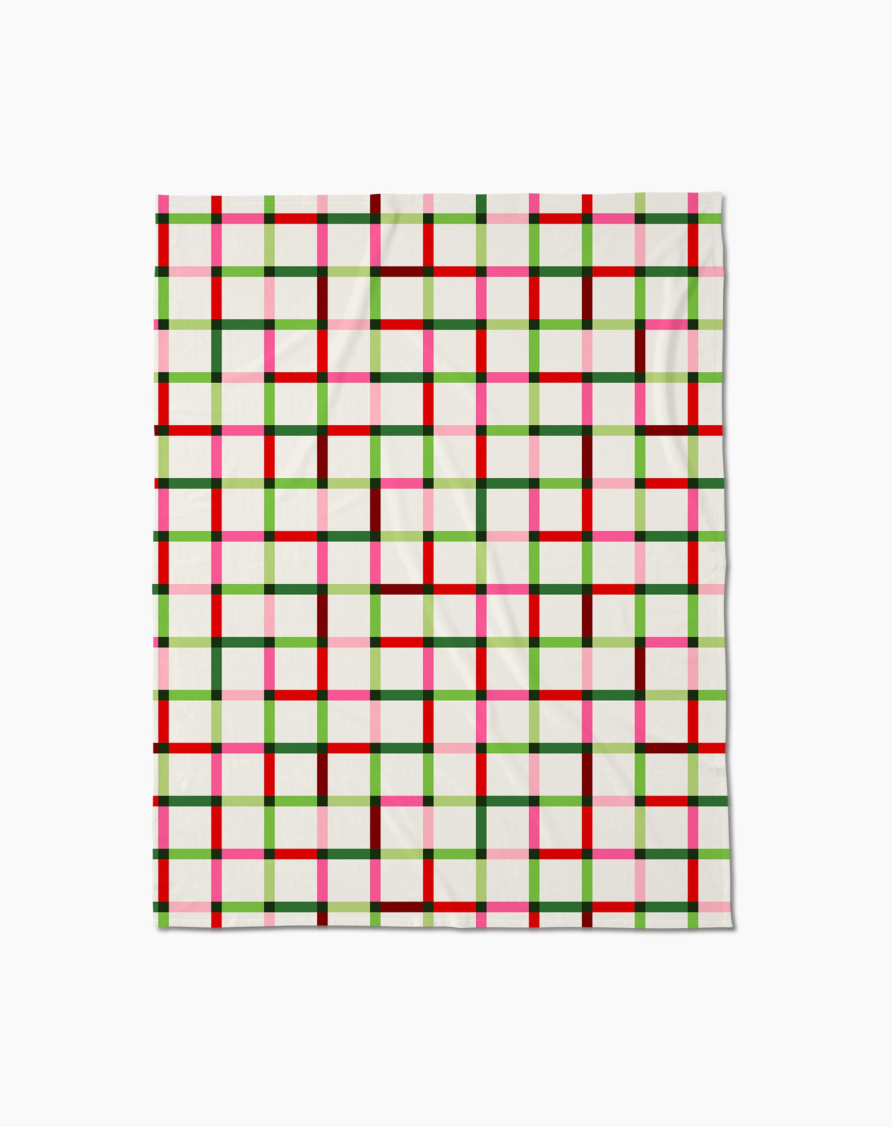 The Season of Joy by Geometry is a square cloth with a plaid pattern of red, green, pink, and black lines on white. Inspired by silky soft blankets, its smooth fabric has gentle folds.