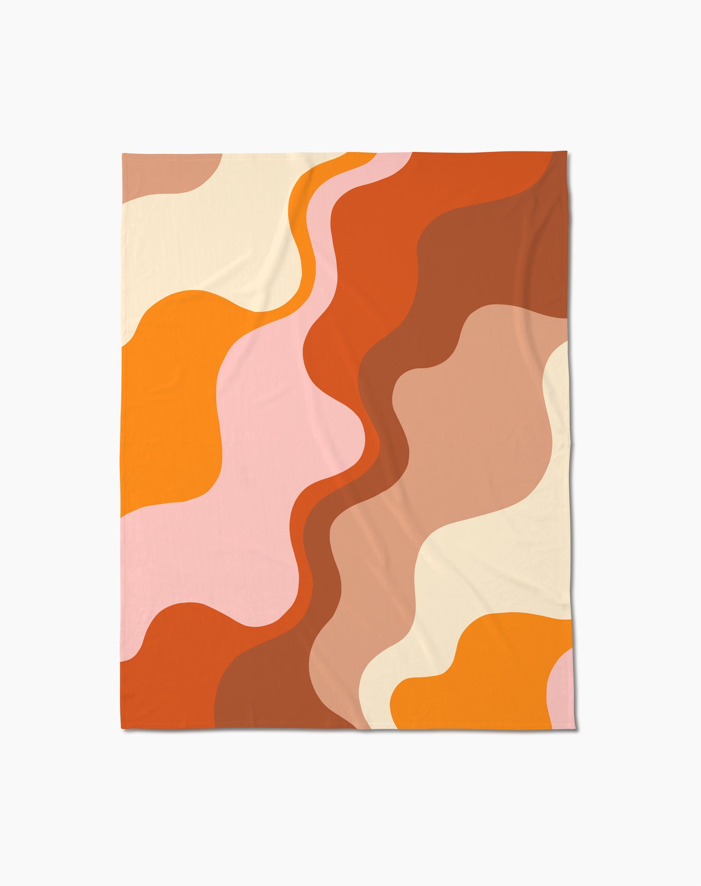 Cozy up with Geometry’s Sunset Waves throw blanket—featuring an abstract wavy pattern in orange, brown, cream, pink, and yellow on white—crafted from recycled materials for sustainable style.
