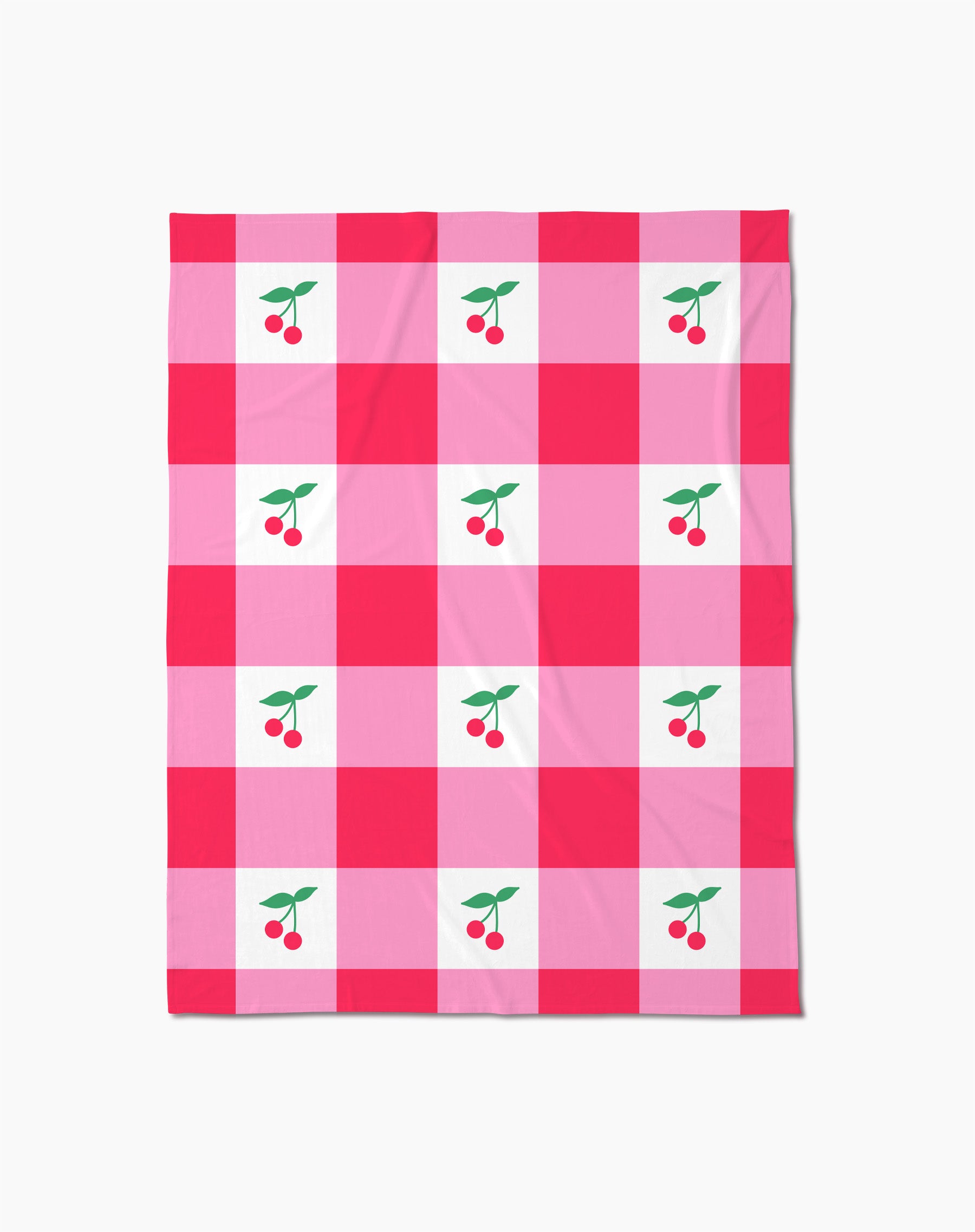 The Geometry Sweet Cherry Gingham throw blanket features a pink and red checkered pattern with white squares, each adorned with two red cherries and green leaves—adding cozy, cheerful comfort to any space.