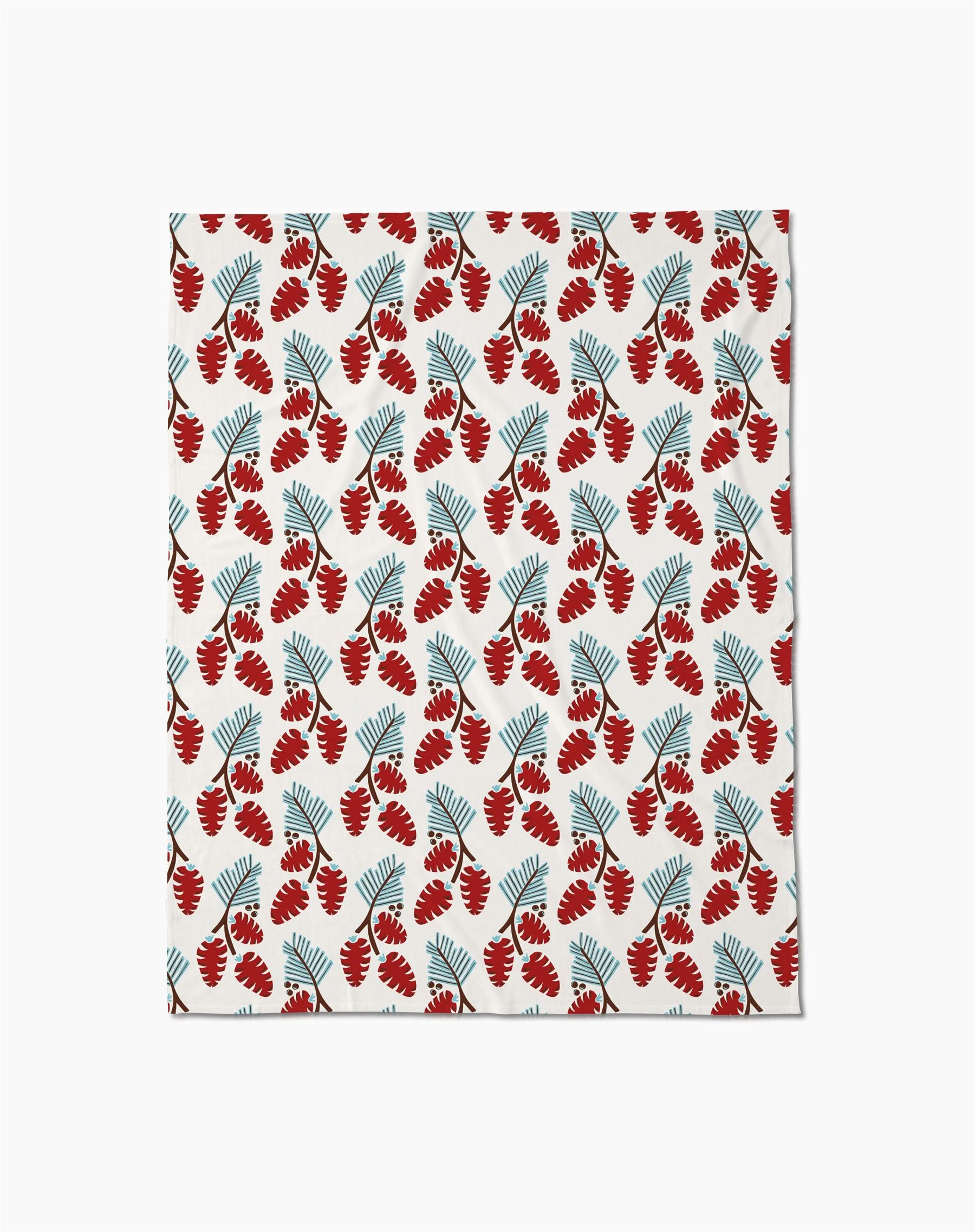Winter Forage by Geometry features a cozy butter blanket with red fern-like leaves and blue fan-shaped leaves in repeating, alternating rows on a white background—perfect for adding style and warmth to any space.