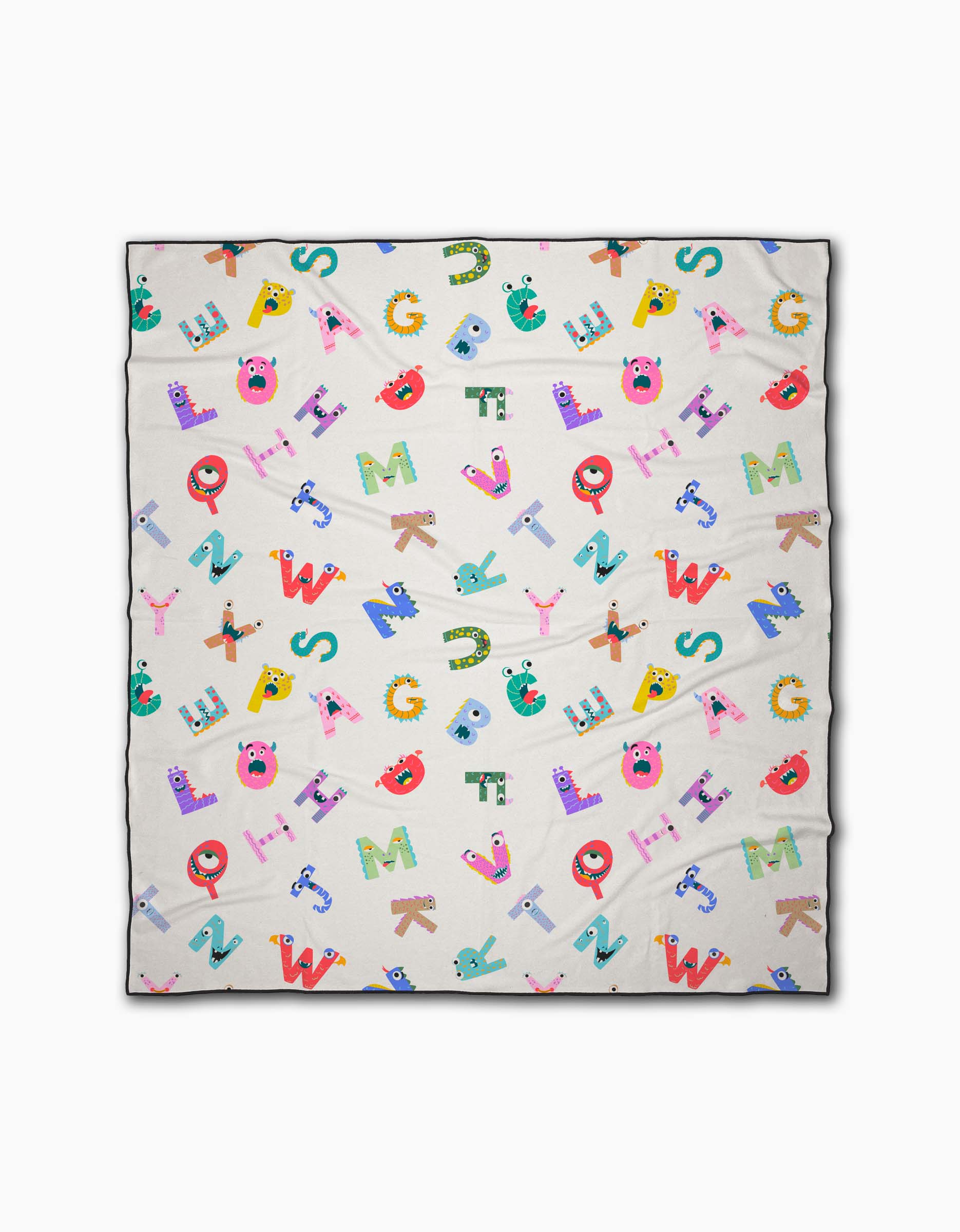 The Alphabet Monsters beach blanket by Vaishali Design Studio features playful cartoon alphabet letters with fun faces on a cream background. Made from quick-drying recycled materials, it offers both eco-friendly comfort and vibrant style.