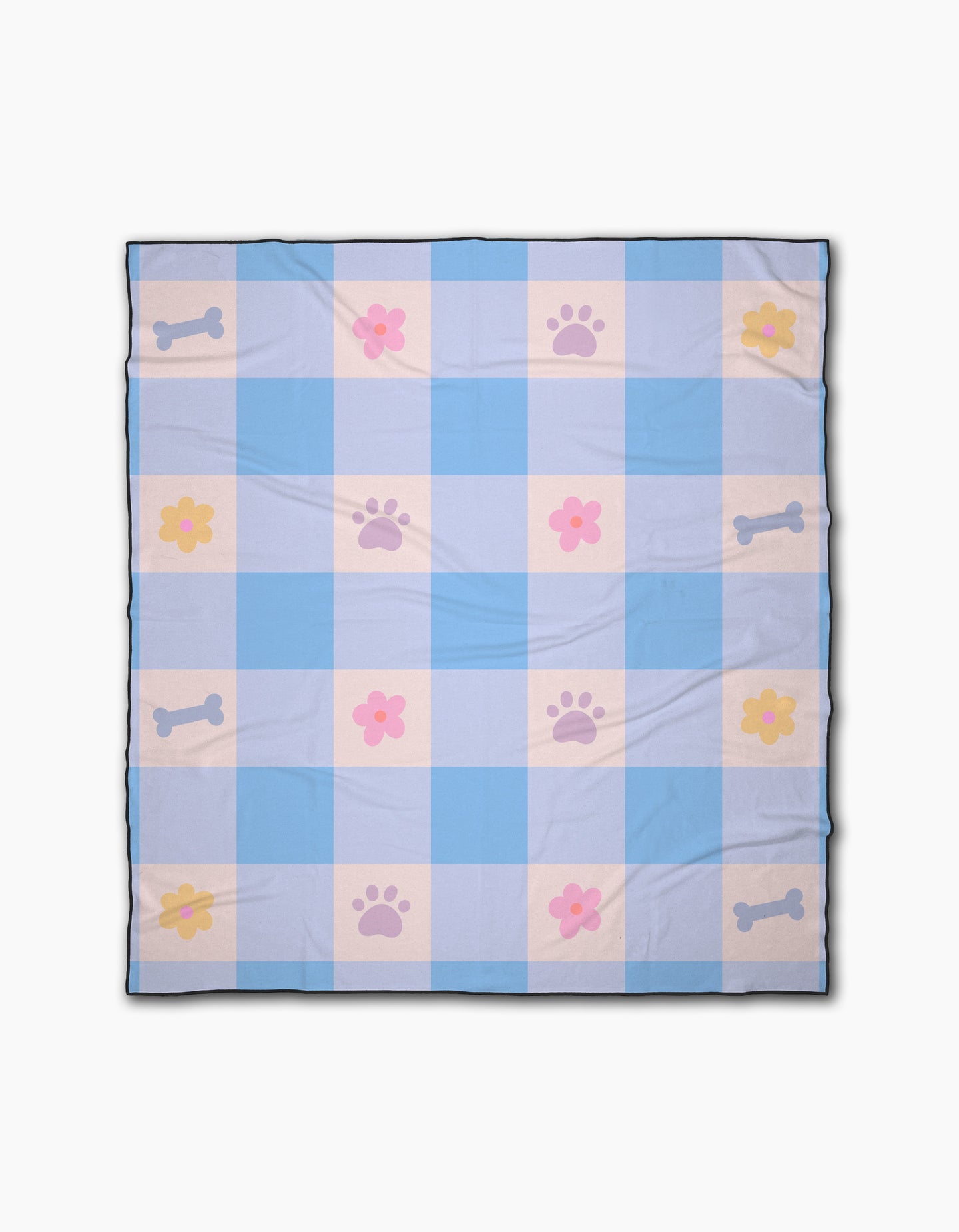 The Blue Sky Picnic Dreams blanket by Letters By Shells is a light blue and white checkered beach blanket with pink paw prints, yellow and pink flowers, and blue bones in a repeating pattern.