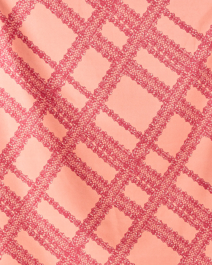 Geometry’s Lacy Plaid features recycled fabric with a pink base and red, diagonally-arranged looped lattice pattern; gentle folds create subtle shadow effects.