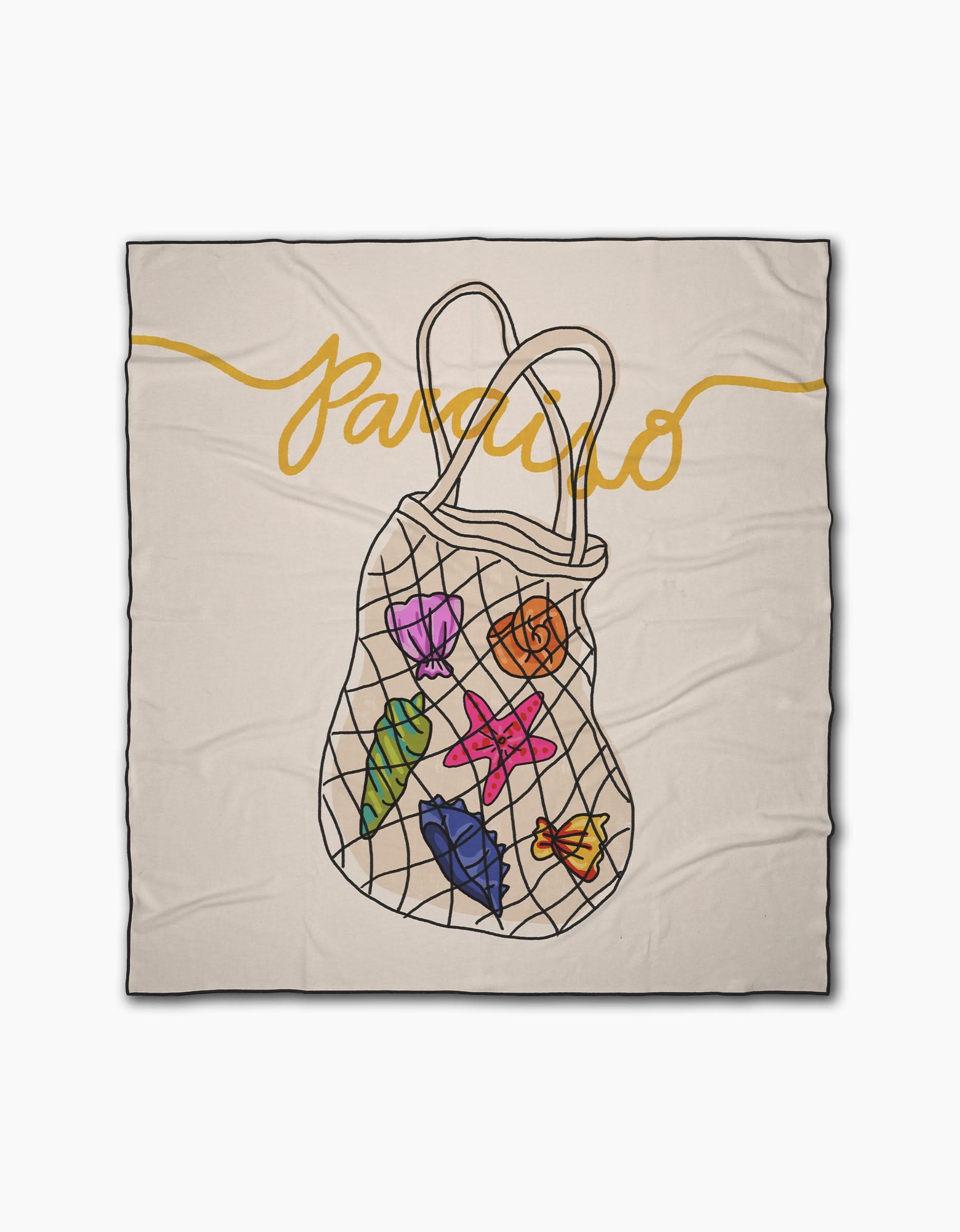 The Paraiso beach blanket by Geometry is beige, made from recycled materials, and showcases Paraiso in yellow cursive with a central illustration of a mesh bag filled with colorful seashells and leaves.