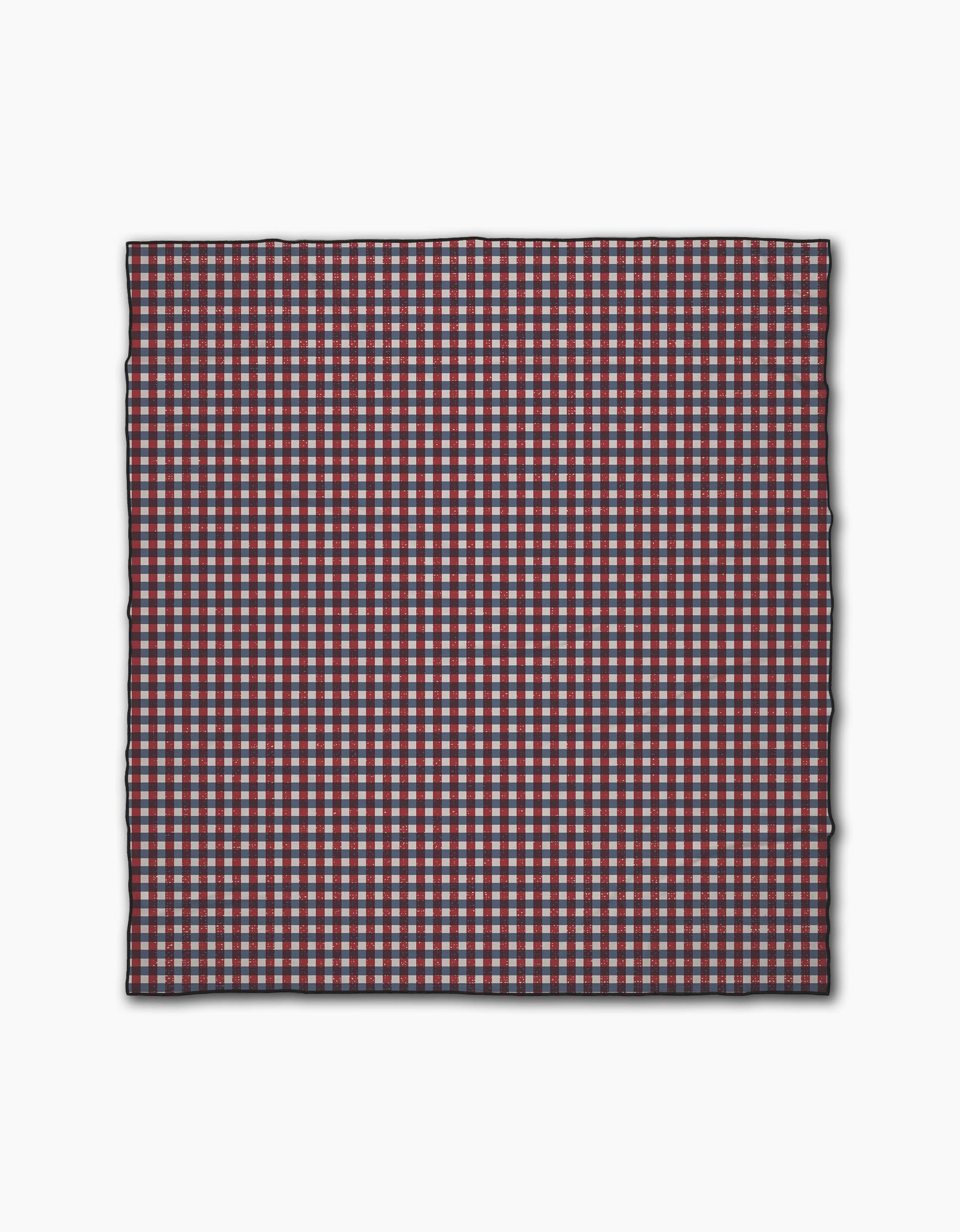 Geometrys Picnic Parade is a square cloth featuring a small red, white, and blue checkered pattern. Made from quick-drying recycled materials, it has neatly finished edges and is shown against a plain white background.