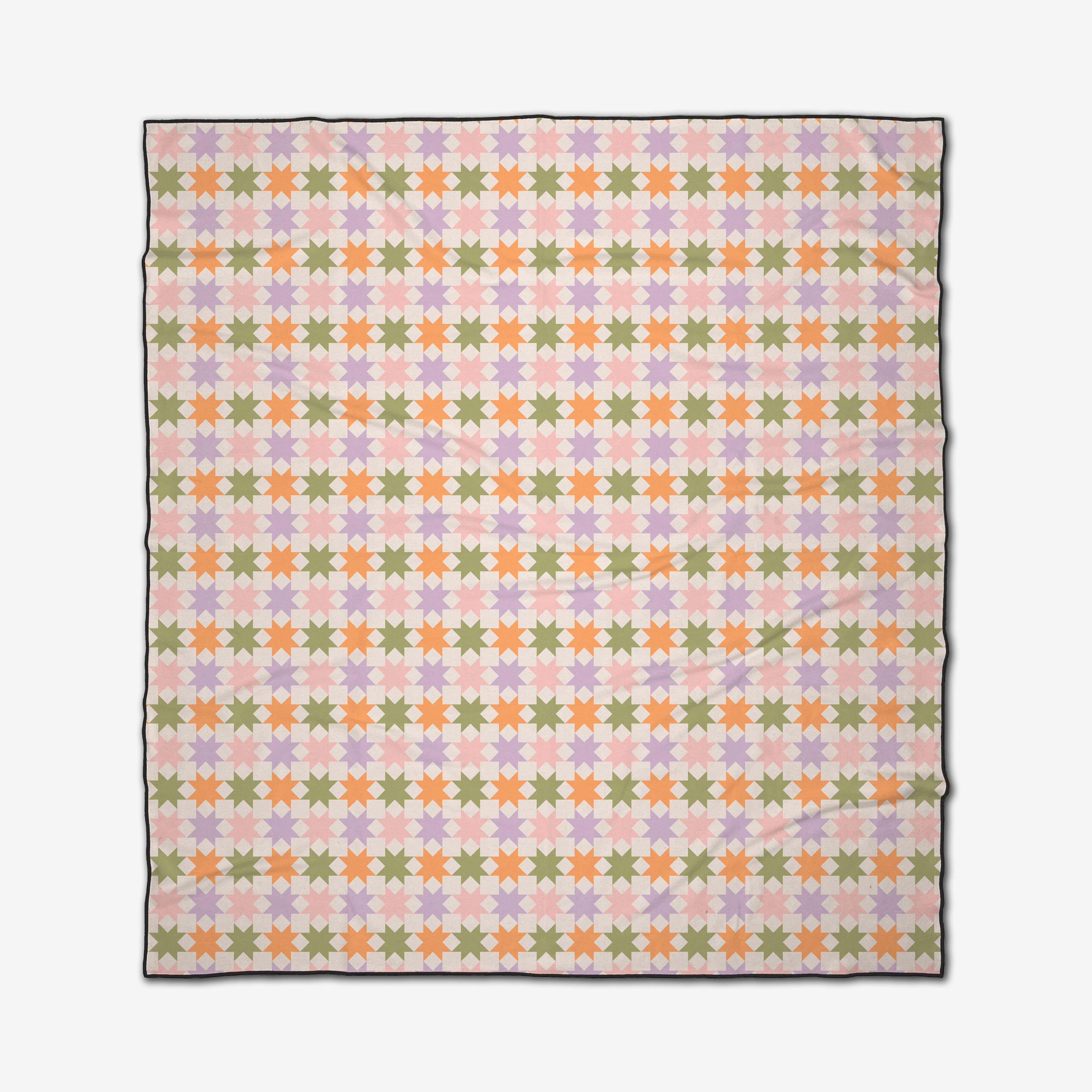 The GEOMETRY Spring Quilt is a compact, quick-drying blanket with a daisy flower pattern in pastel pink, yellow, green, and orange on white with a black border. Made from recycled materials for eco-friendly comfort.