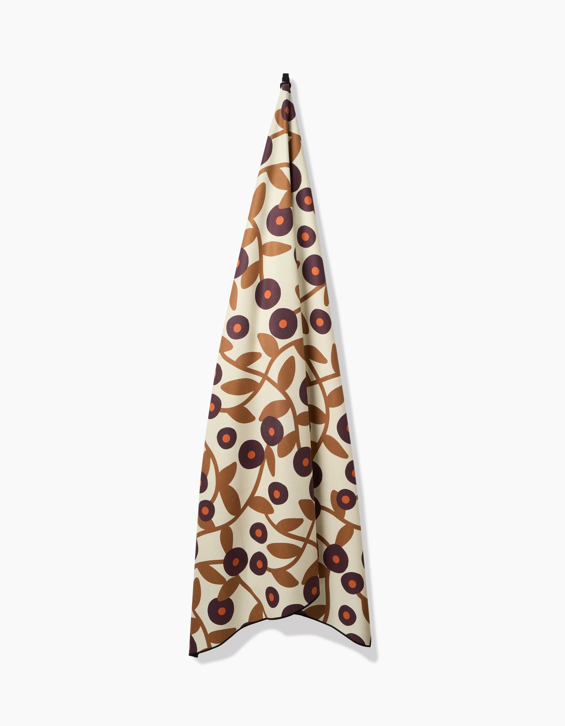 The Swirling Vines beach blanket by Lizzie Clark features a quick-drying fabric with a cream background and a bold, abstract floral pattern in brown, tan, and dark red.