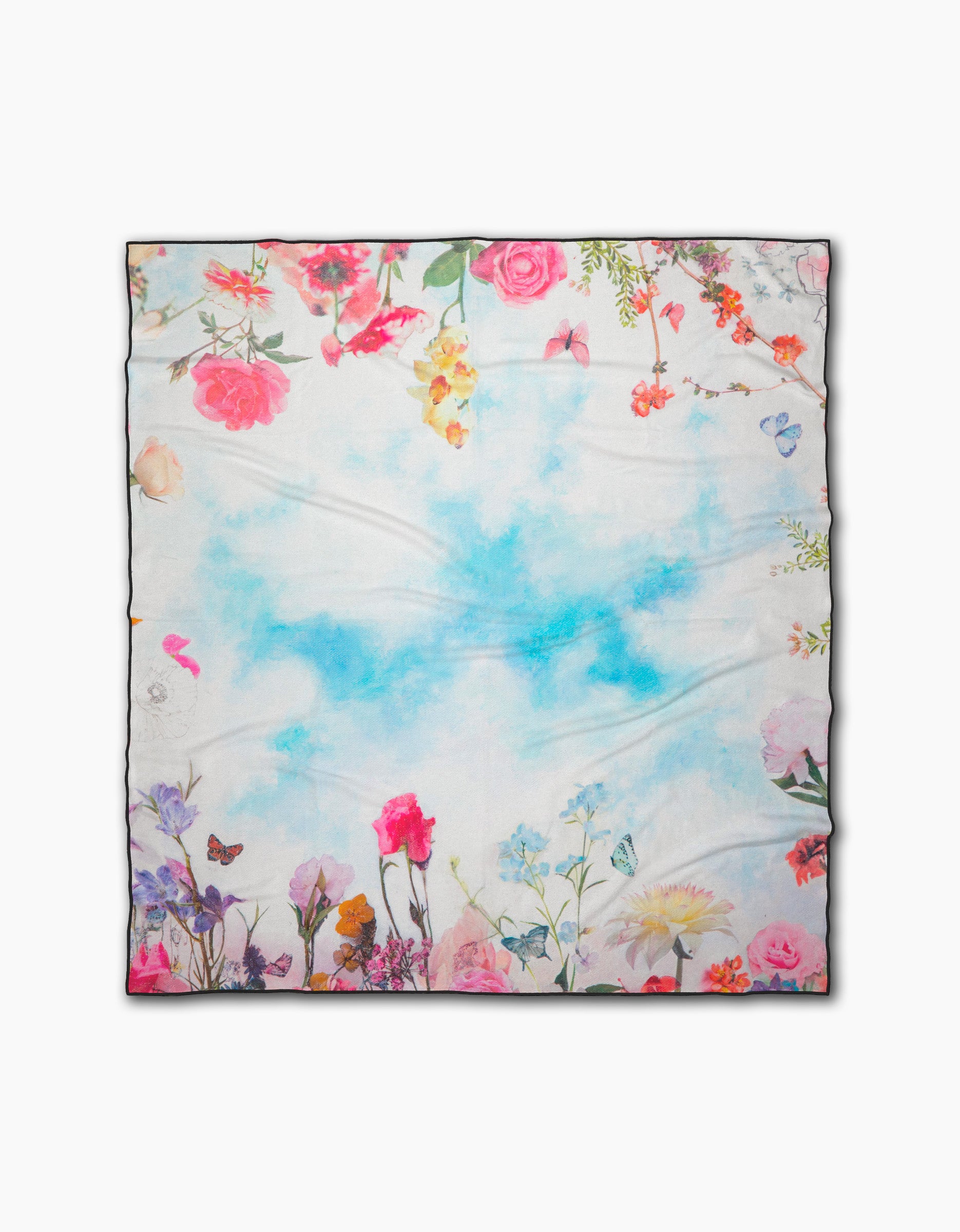 Toward the Sun by Stefanie Bales is a square silk scarf with a watercolor sky-blue center and colorful floral, butterfly, and blossom borders—ideal to pair with your favorite quick-drying beach blanket for a breezy, elegant look.