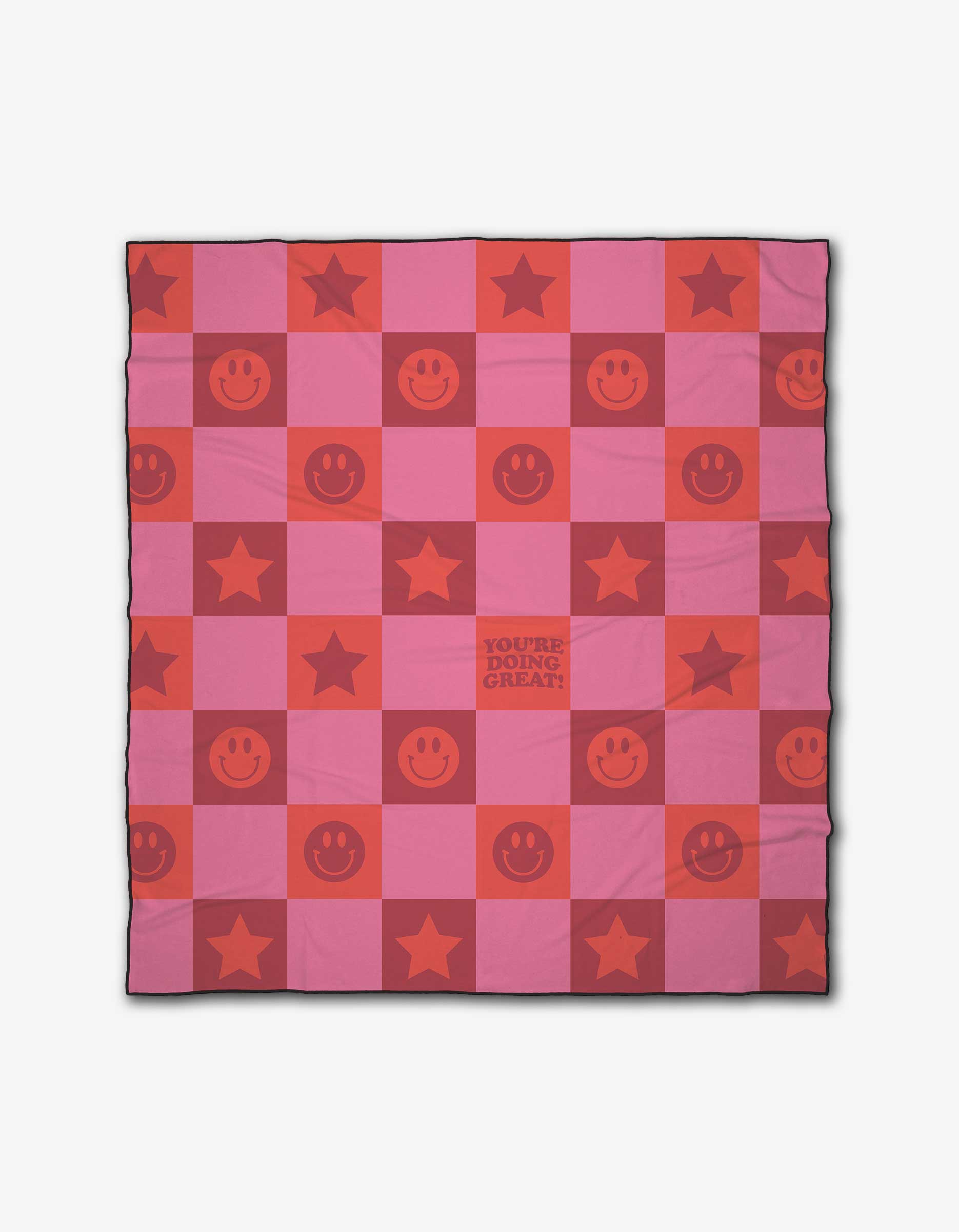The Youre Doing Great beach blanket by Quotes by Christie features pink and red checks with stars, smiley faces, and a central YOURE DOING GREAT! square. Made from quick-drying recycled materials for easy use anywhere.