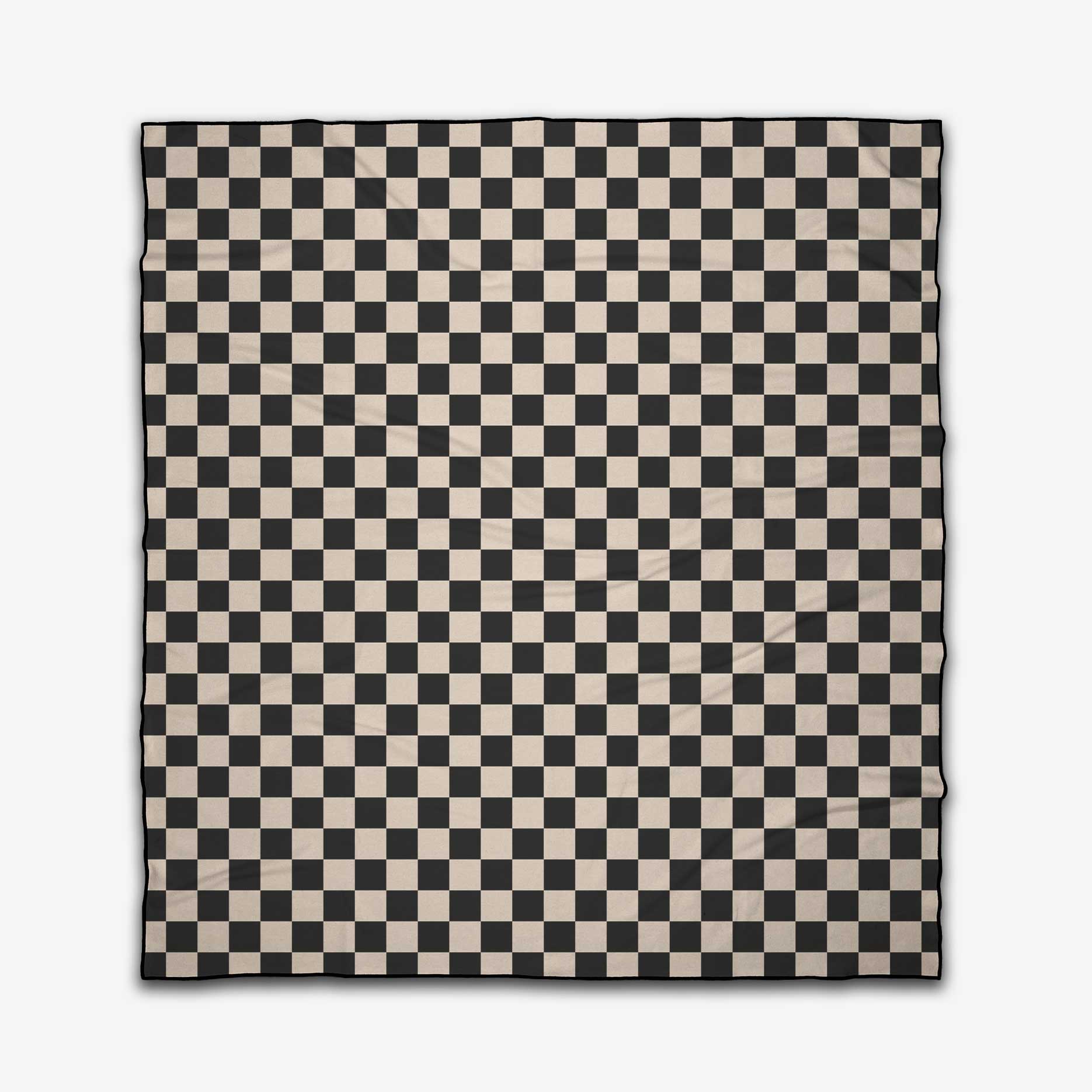 The GEOMETRY Classic Checker Micro-loop Beach Blanket showcases a timeless black and white checkerboard design, made from quick-drying recycled materials and displayed on a plain white background.