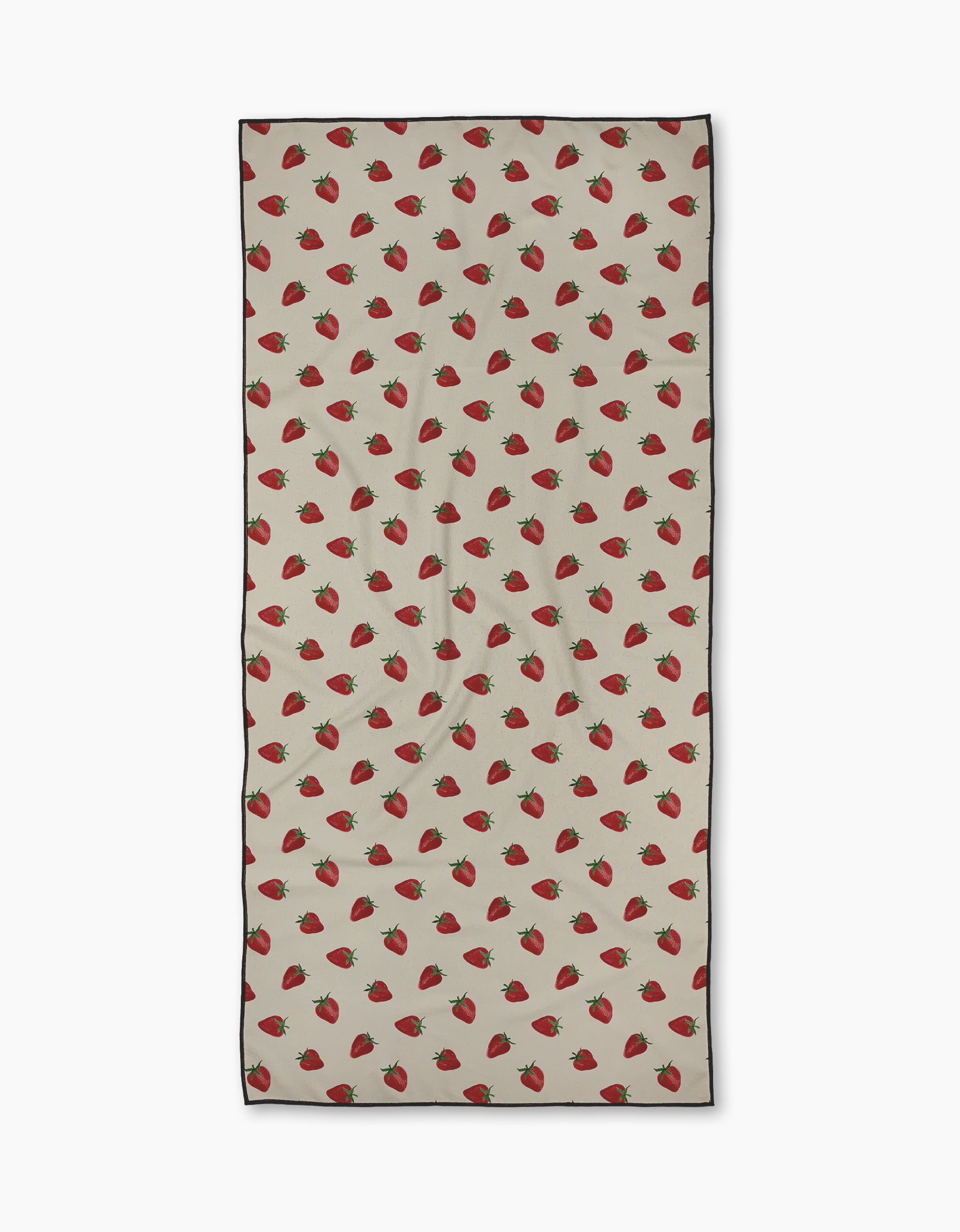 The Geometry Berry Patch towel is a beige rectangular quick-drying towel with a repeating pattern of evenly spaced red strawberries and green leaves across the surface.