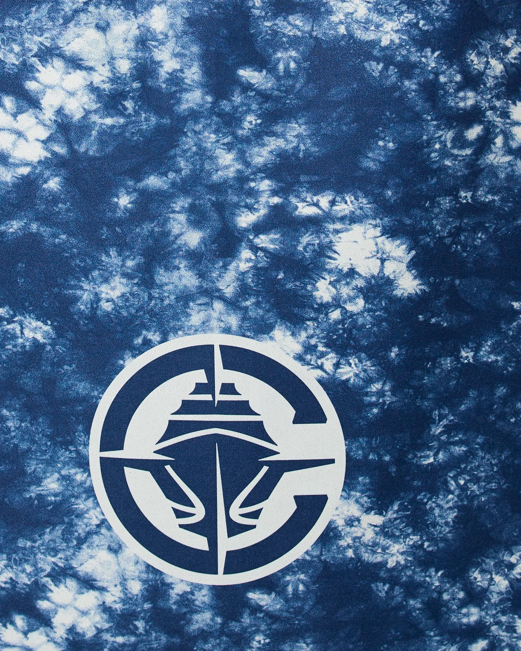 The Geometry Clippers Flash features a white ship graphic inside a letter C with a compass design, printed on a blue and white tie-dye background.