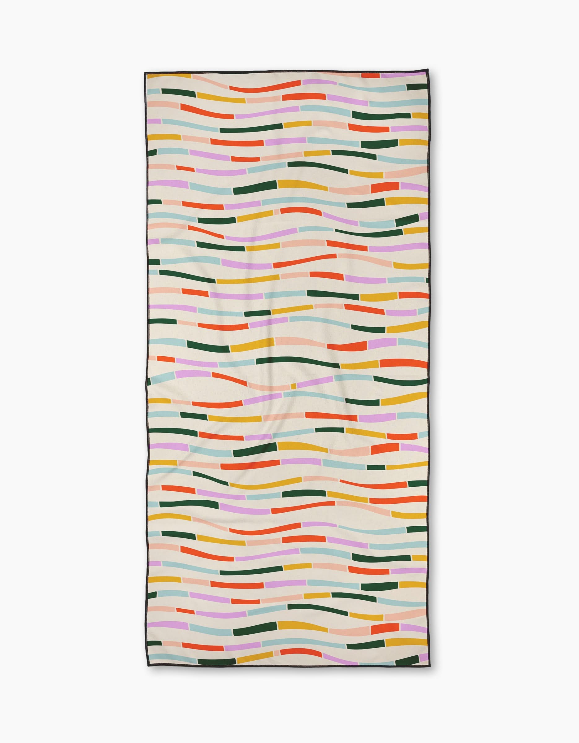The Geometry Colorful Currents Micro-loop Beach Towel features a modern pattern of wavy orange, green, pink, yellow, and red lines on light beige with a black edge. Made from quick-drying recycled materials.
