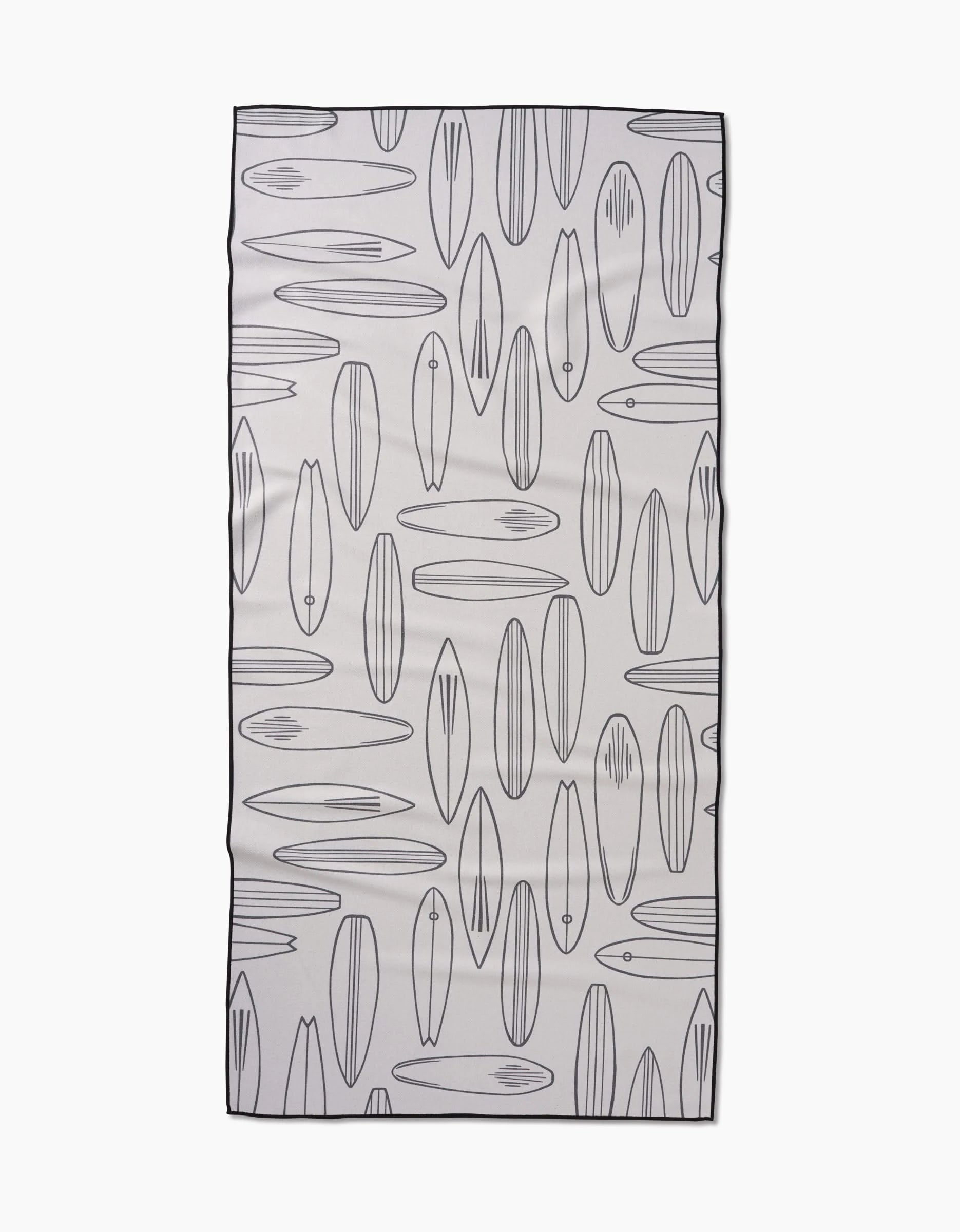 The Cream Summer Surfing beach towel by Hufton Studio quickly dries and showcases a repeating pattern of outlined surfboards in different shapes and sizes on a white background, all edged with a thin black border.