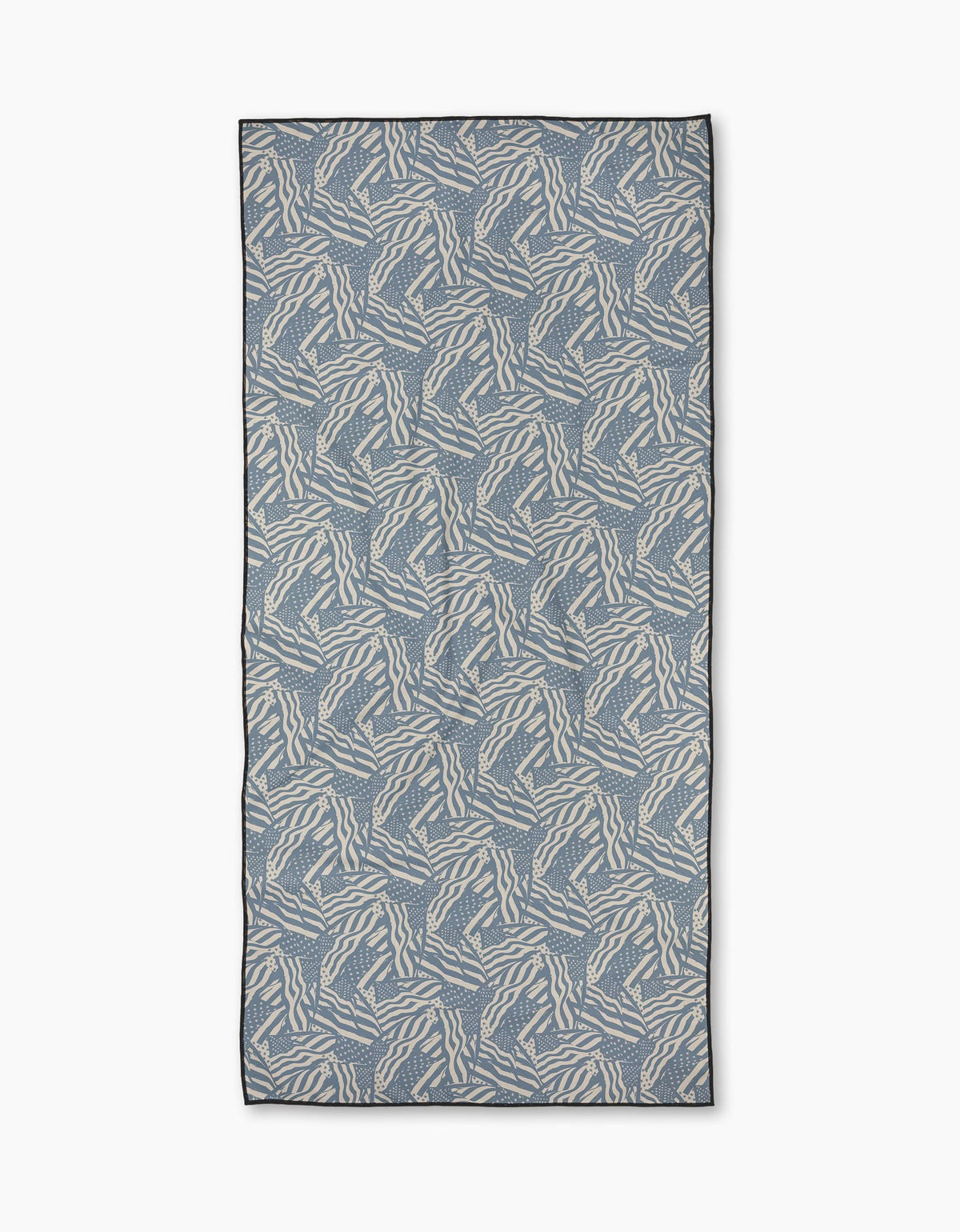 The Homegrown Beach Towel by Geometry features a blue-gray background with an abstract white zigzag pattern, thin dark edging, and is crafted from quick-drying recycled materials for eco-friendly comfort.