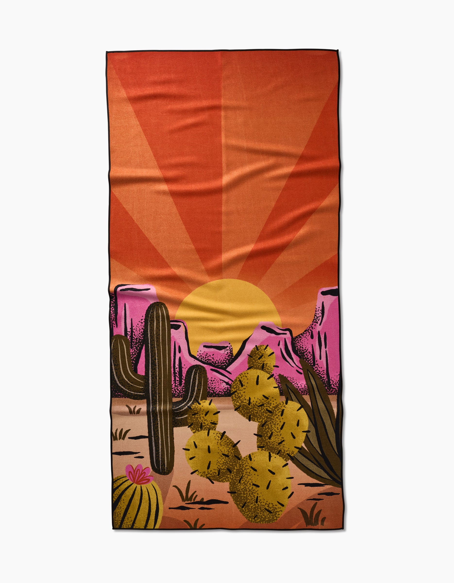 A quick-drying In The Desert Geometry Micro-loop Beach Towel by Megan Roy, featuring cacti, yellow prickly pears, pink rocks, and an orange sunburst sky.