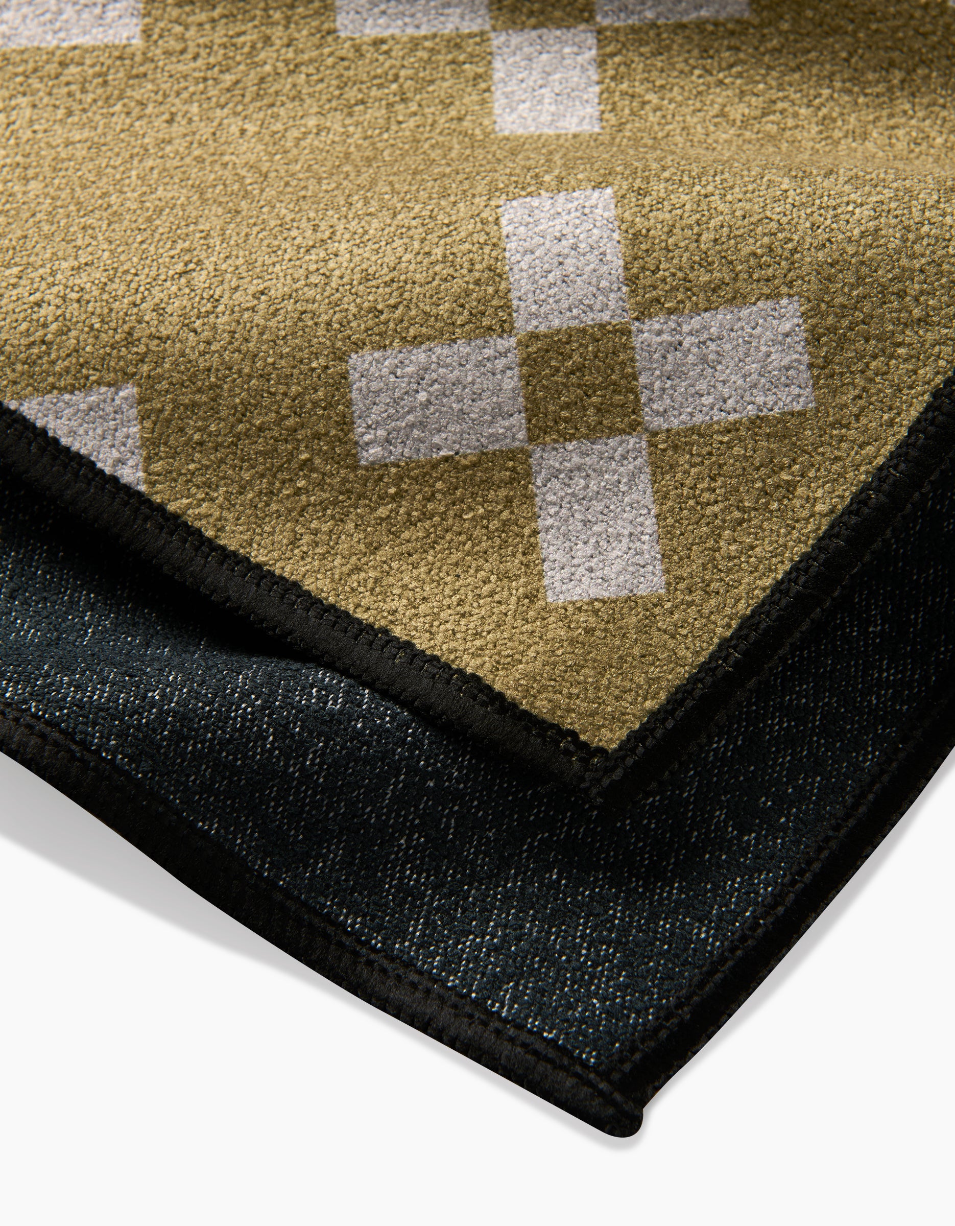 A close-up of the Lina quick-drying towel by Anna Christian, crafted from recycled materials.