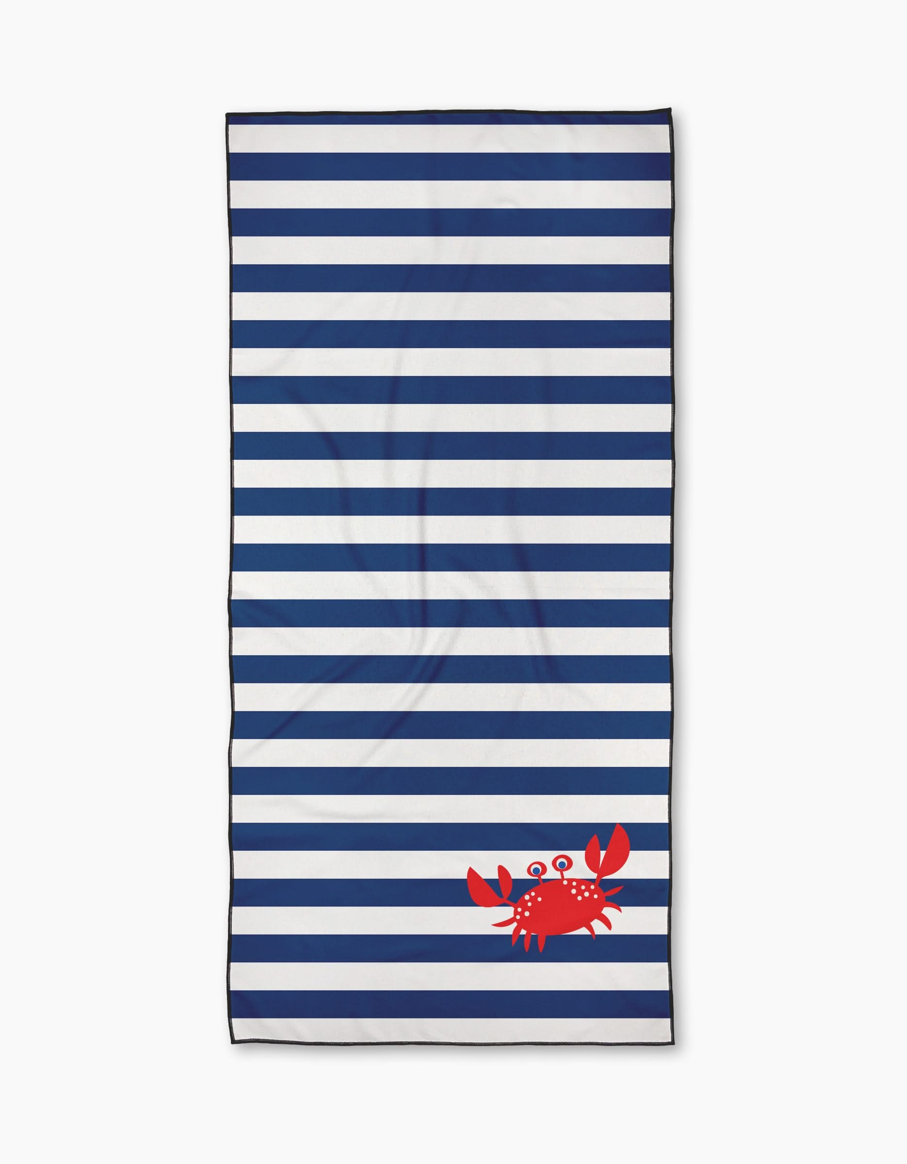 The Geometry Nautical Nipper is a rectangular beach towel made from quick-drying recycled materials, showcasing navy and white horizontal stripes with a small red cartoon crab in the bottom right corner.