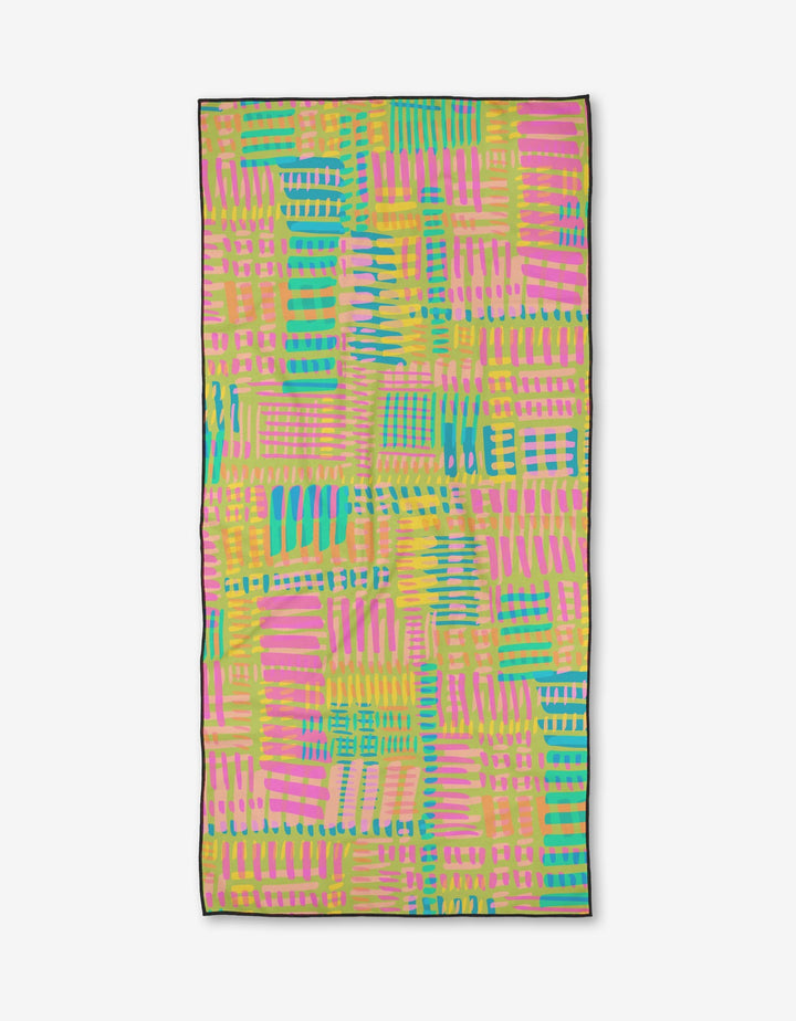 The Positive Vibes Beach Towel by Sareka Unique features a vibrant geometric pattern with overlapping pink, yellow, green, and blue stripes and rectangles on a light background, plus quick-drying fabric and a dark border.