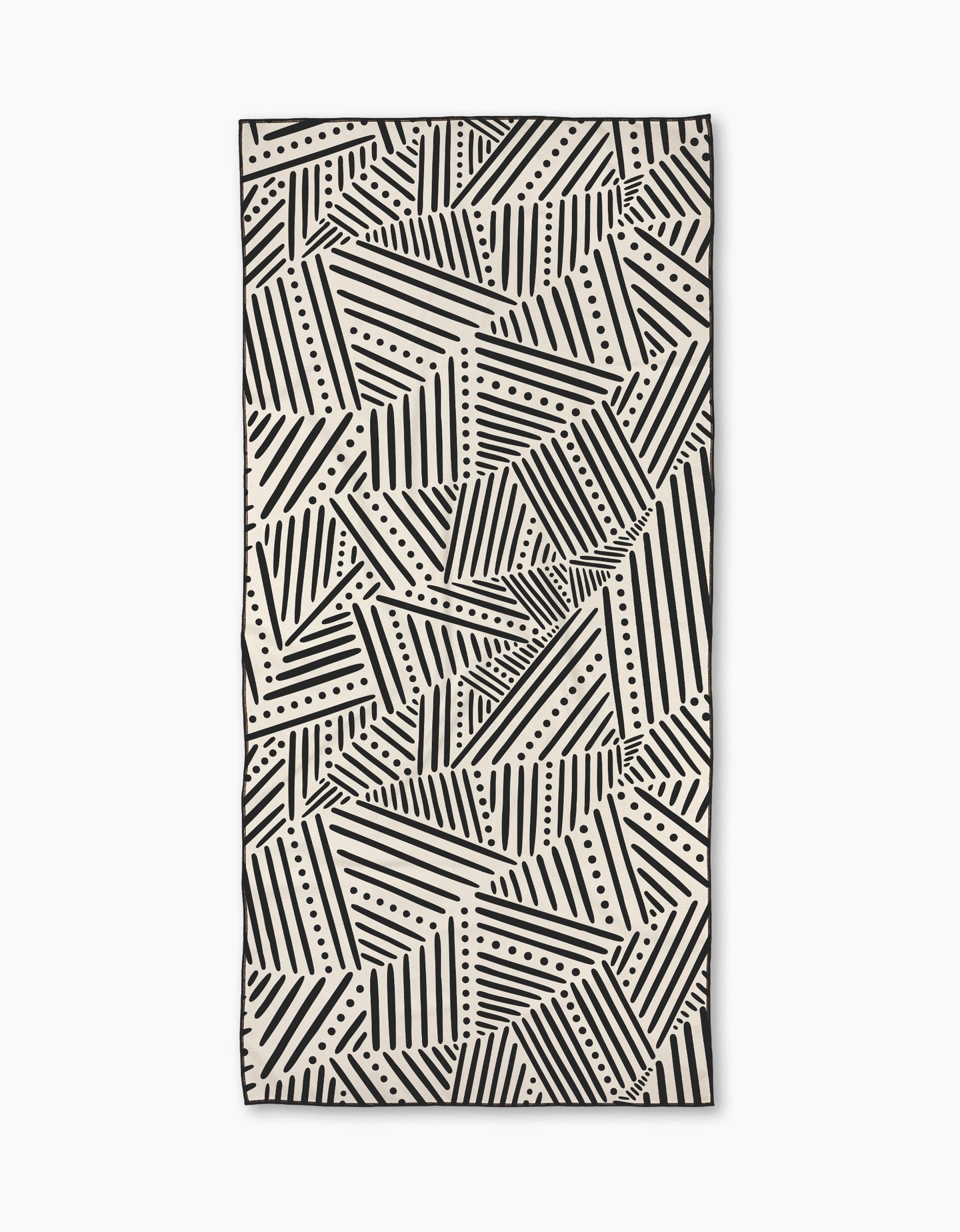 The Rhythm Current Stripes towel by Sarah Daugherty is a rectangular beach towel with a black and white geometric pattern of diagonal lines and dots, creating an abstract, repeating design.
