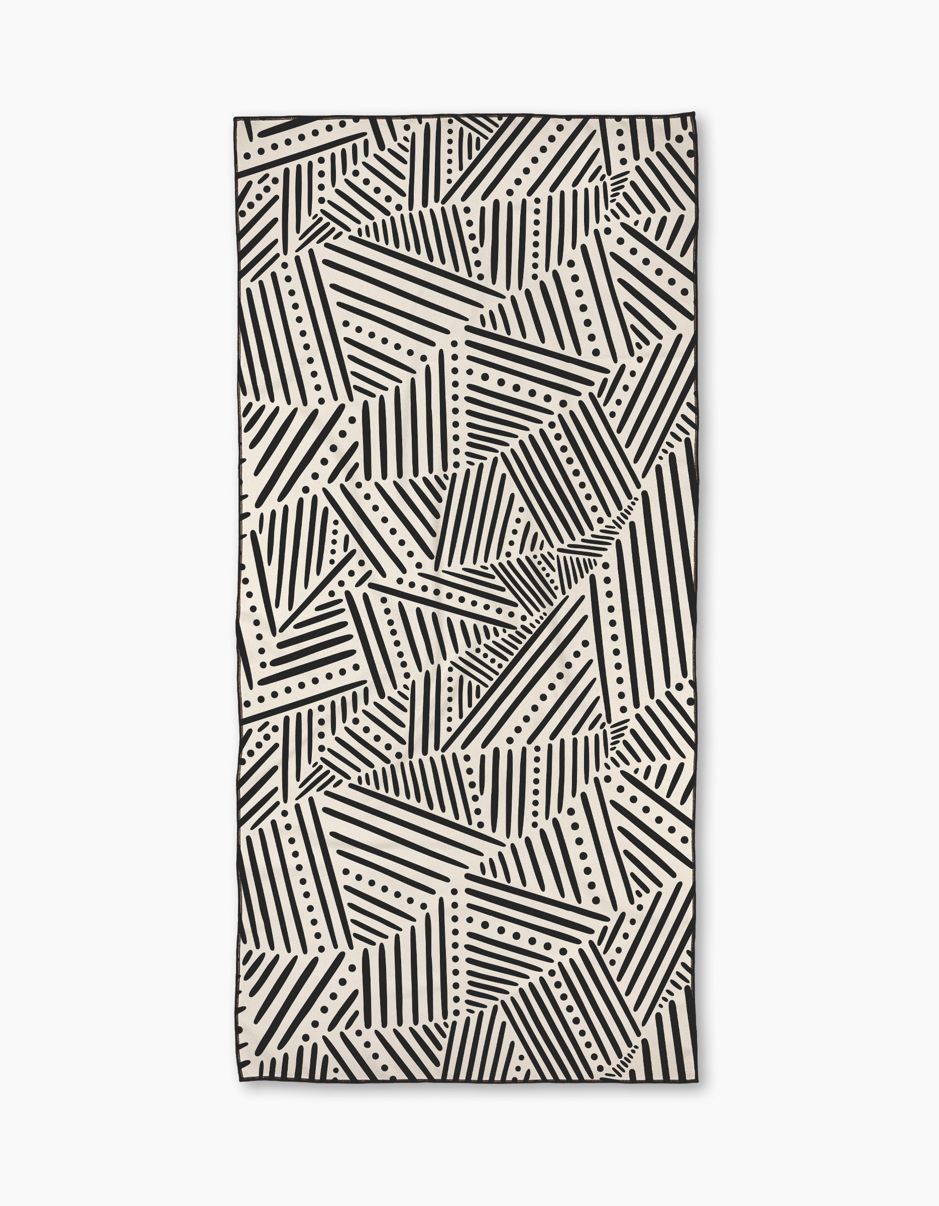 The Rhythm Current Stripes towel by Sarah Daugherty is a rectangular beach towel with a black and white geometric pattern of diagonal lines and dots, creating an abstract, repeating design.