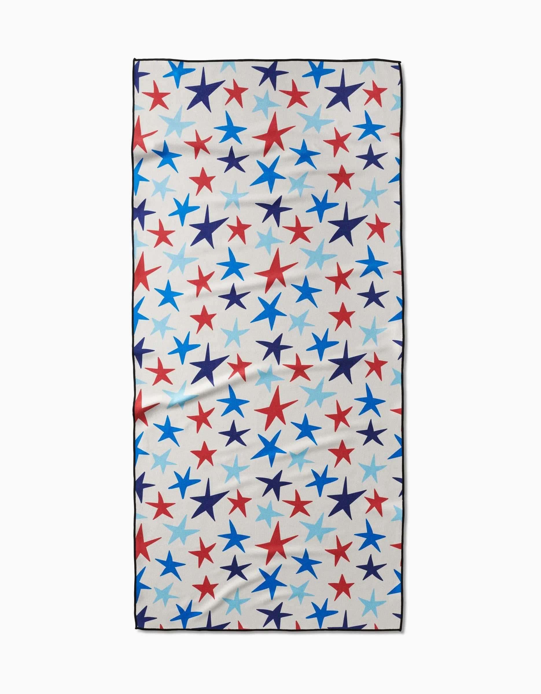 The Mindfulnice Seeing Stars beach towel features a rectangular shape and a white background with red, blue, and light blue star patterns. Made from quick-drying fabric, it offers convenience after every swim.