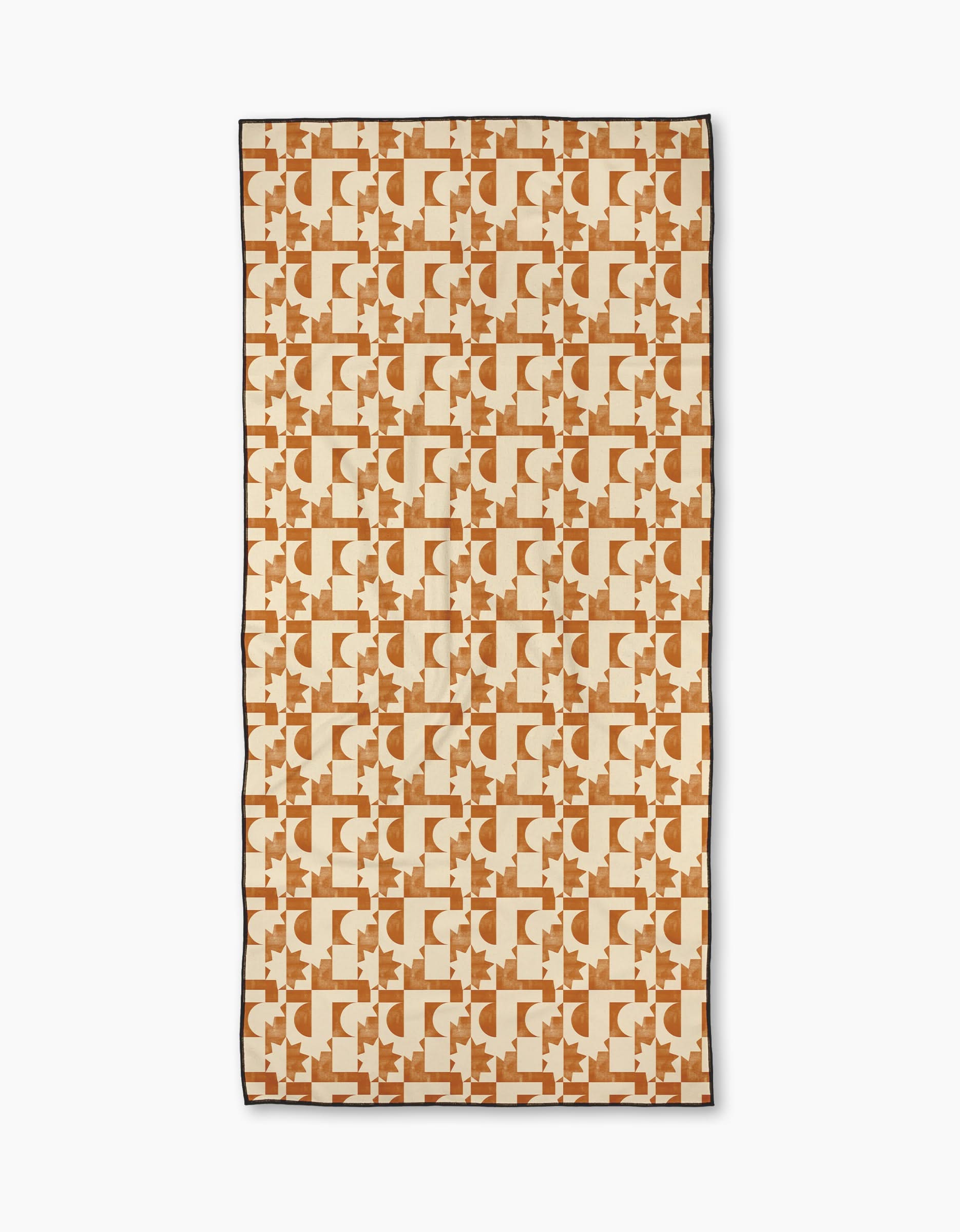 The Geometry Solar Power Micro-loop Beach Towel features a geometric pattern in tan and brown with interlocking designs on a cream background, made from quick-drying recycled materials.