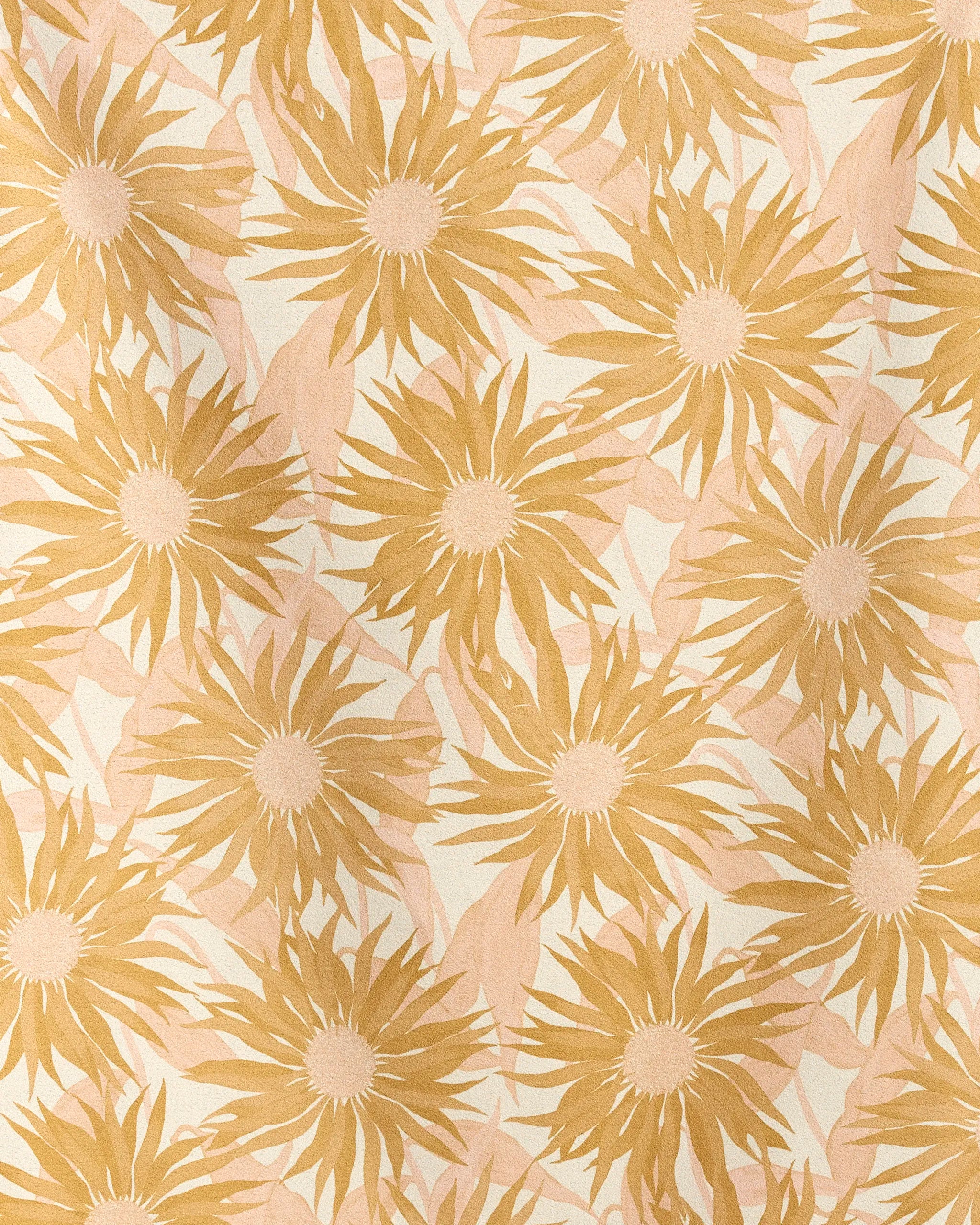 The Geometry Sundara Micro-loop Beach Towel features a repeating pattern of golden yellow sunflowers with spiky petals and soft pink leaves on a light beige background for a nature-inspired look.