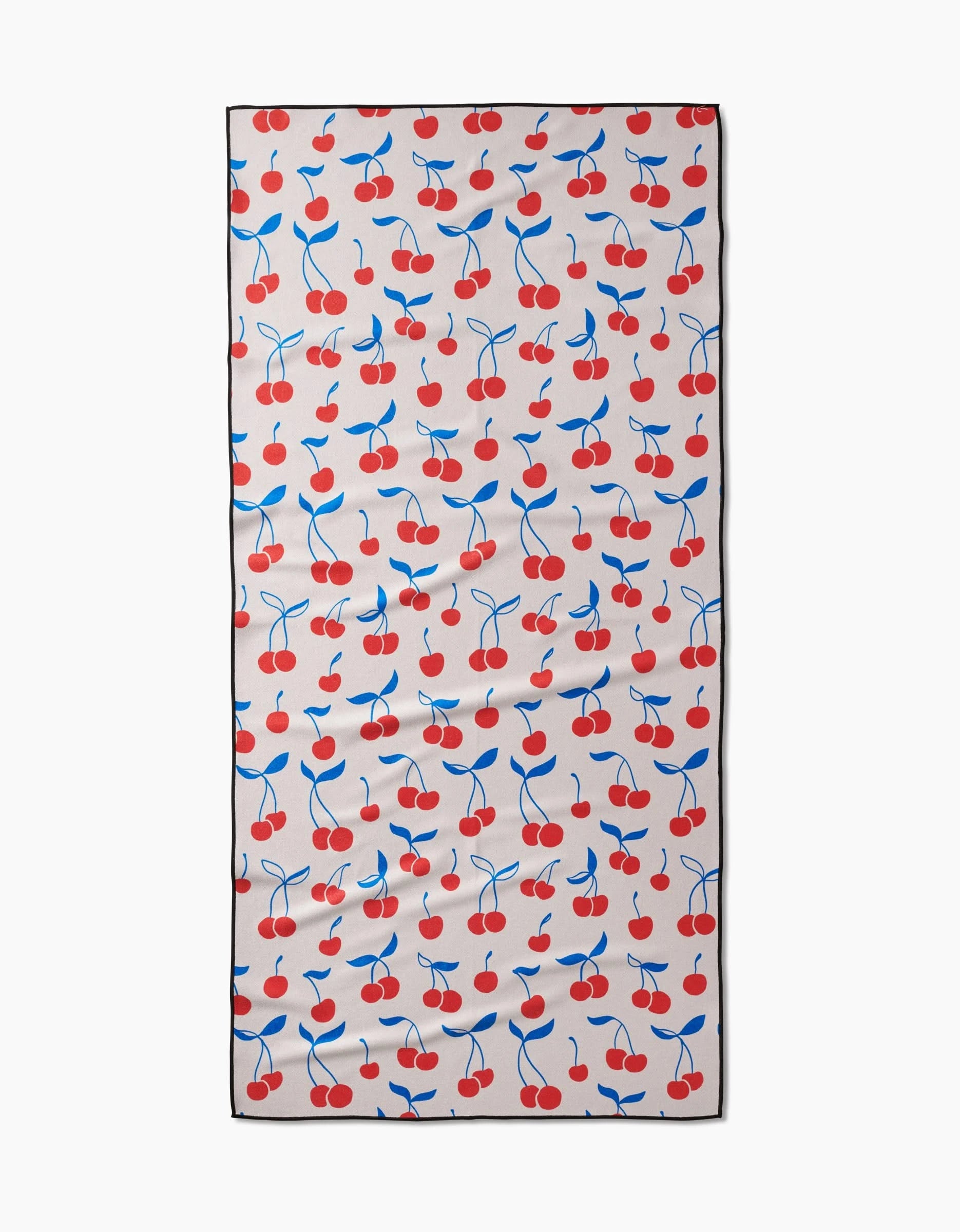 The Kayla Ann Very Cherry Micro-loop Beach Towel features red cherries and blue leaves on light beige, bordered in black. Compact, quick-drying, and crafted from recycled materials.