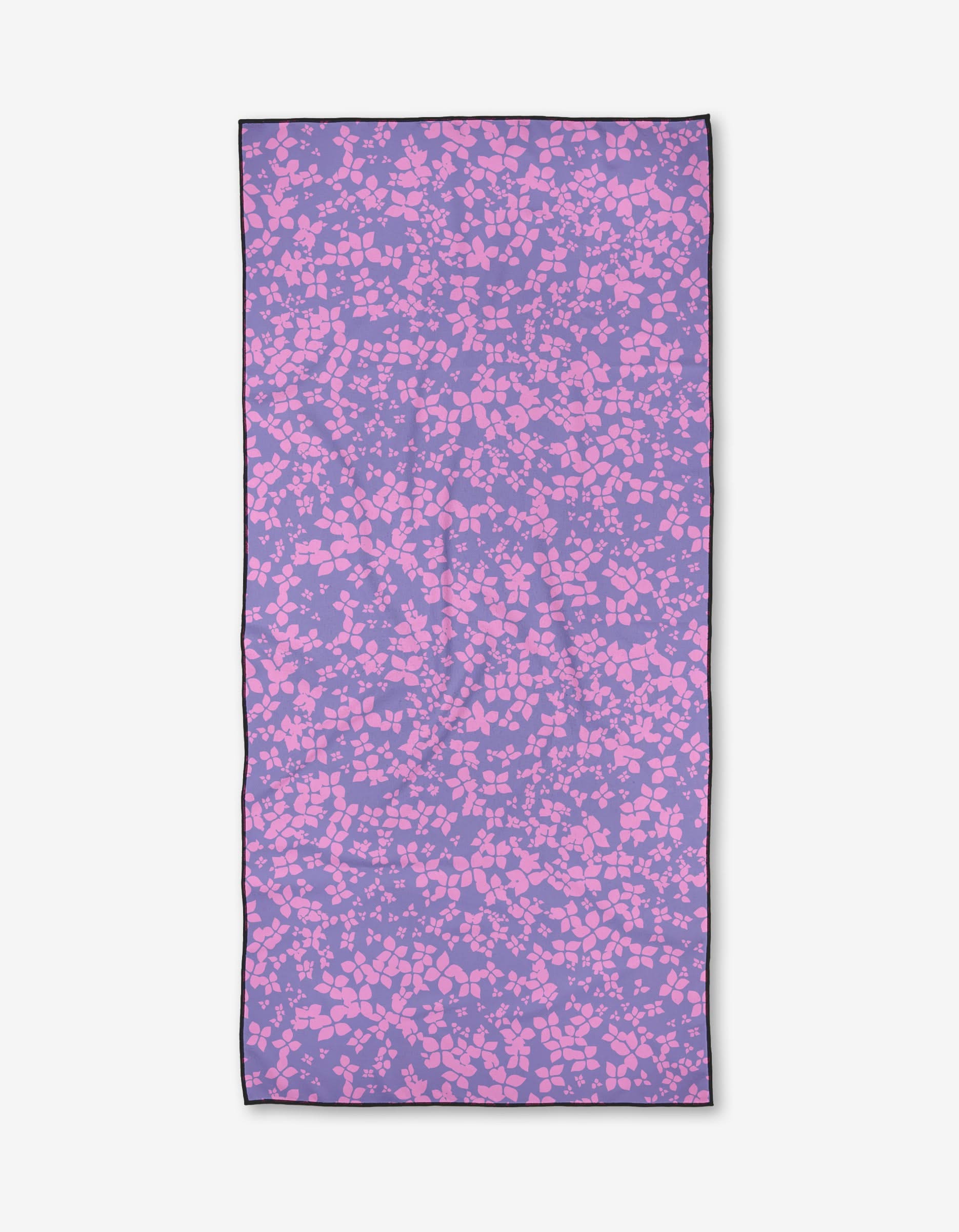 The Sareka Unique You Give Me Butterflies towel is a rectangular, quick-drying beach towel with a purple background and abstract pink shapes like pebbles or confetti, all outlined by a thin black border.