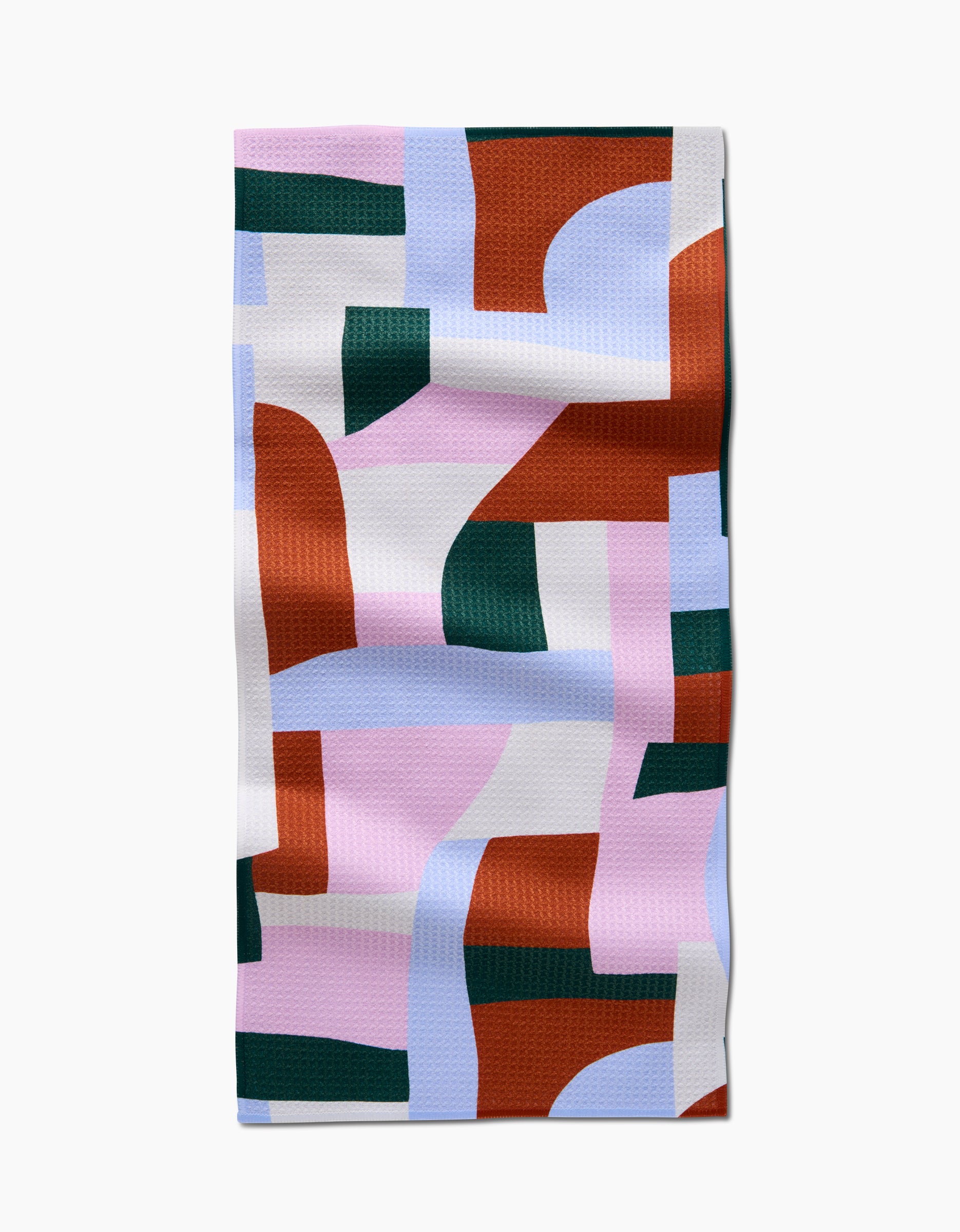 The Abstract Collage bar towel by Claire Iglesias is rectangular, made from recycled materials, and features an abstract pattern with rust orange, forest green, light blue, white, and pink shapes on a textured surface.