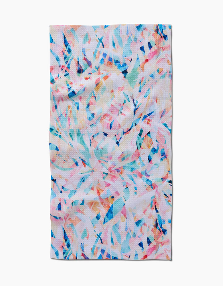 The Abstract Jungle bar towel by Rachel Parker is rectangular and made from recycled materials, showcasing a colorful abstract pattern with swirling pastel blue, pink, orange, and white shapes on a light background.