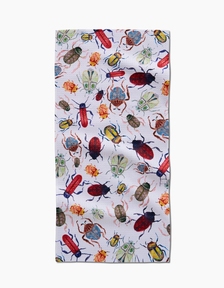 The Taryn Brennan African Beetles Bar Towel features colorful illustrated beetles and bugs on white Geoweave fabric in a rectangular shape.