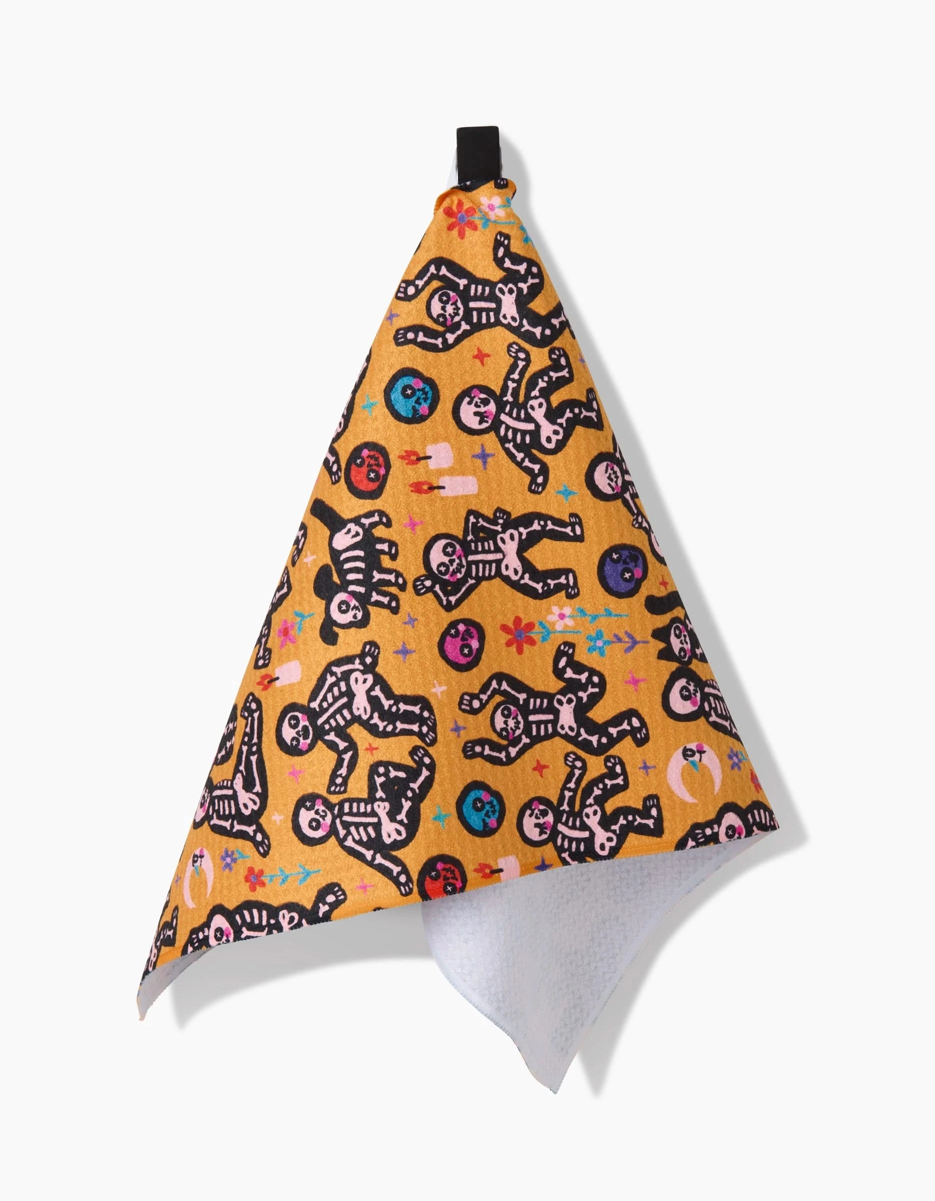 The So Lazo After Party bar towel is yellow, eco-friendly with a hanging loop, and showcases playful skeletons plus bright pink, blue, purple, and black shapes.