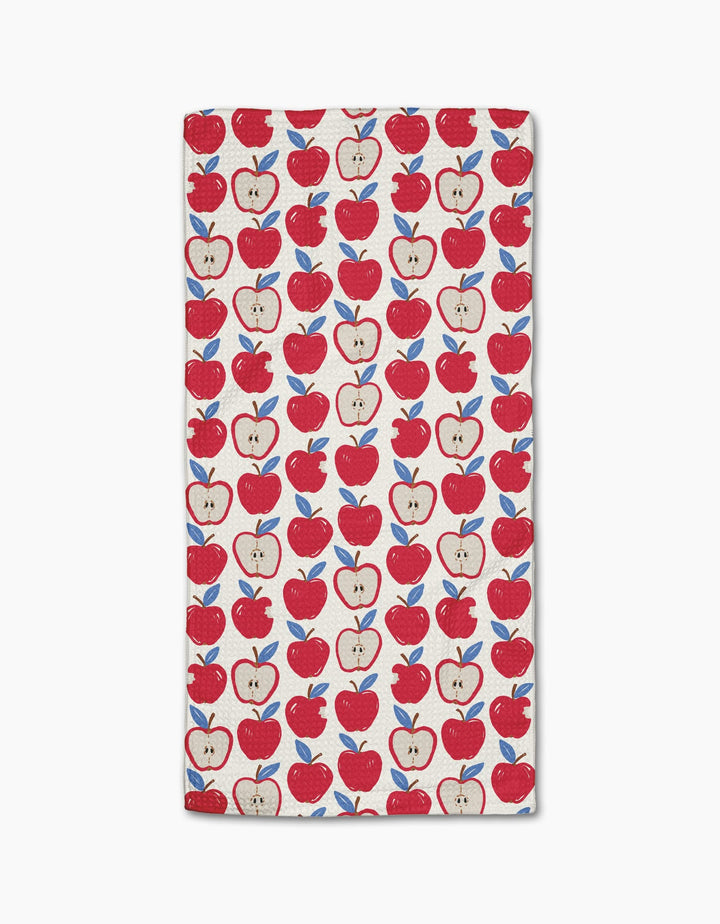 Apple A Day by Hufton Studio is a rectangular white bar towel with red whole and sliced apples and blue leaves, evenly spaced. Made from Geoweave fabric for superior softness and durability.