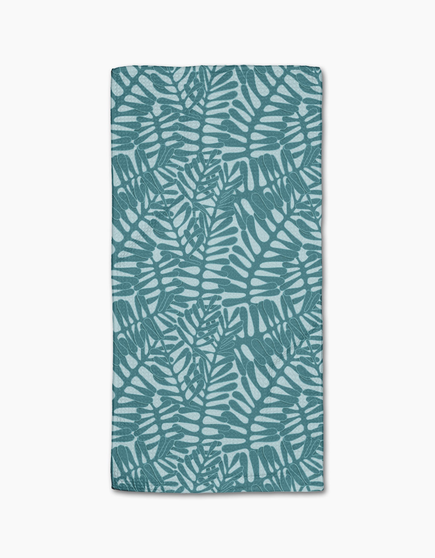 The Aqua Modern Palm towel by Katie OShea is rectangular and ultra-absorbent, showcasing a teal palm leaf pattern on a light blue background with overlapping tropical leaves in a repeating design.
